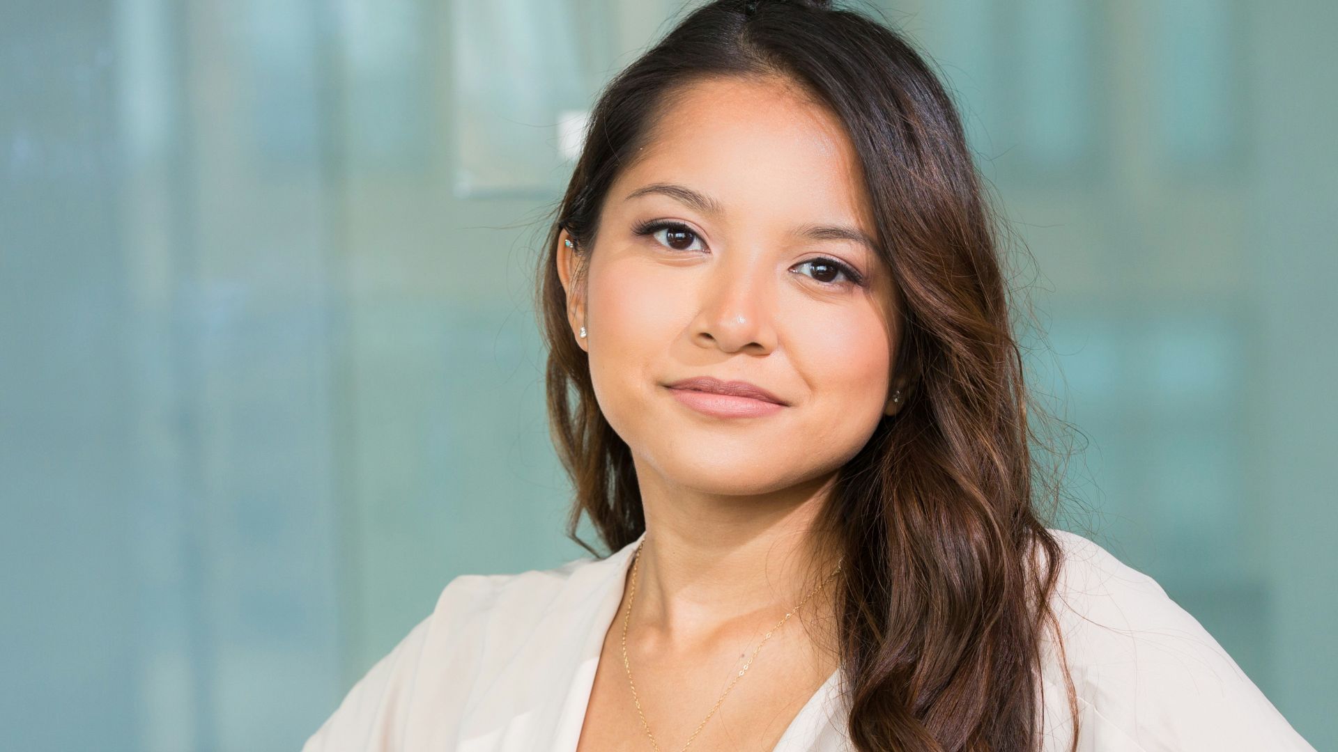 woman smiling and sitting