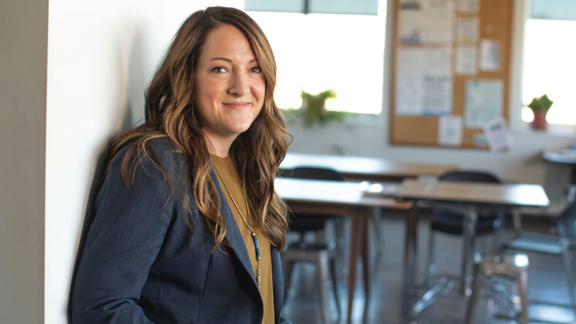 woman in black coat sitting on chair