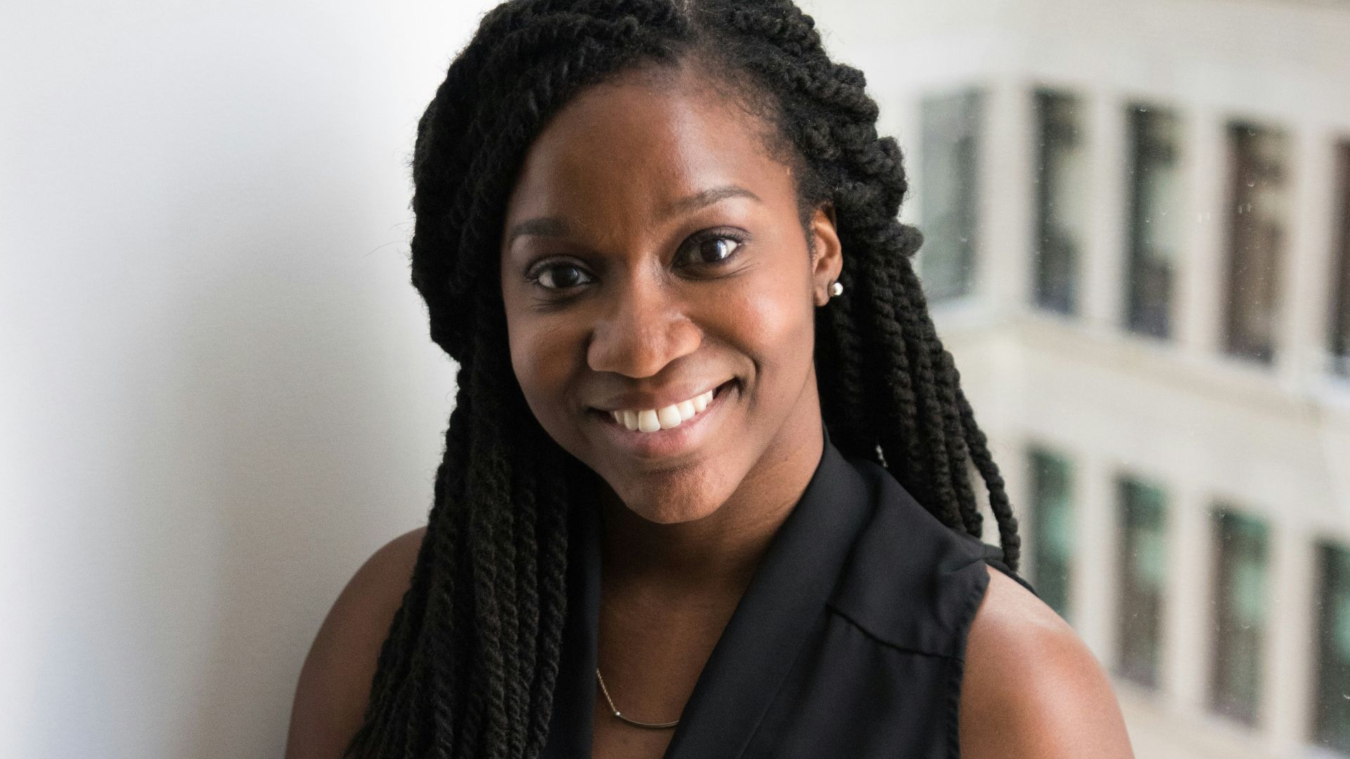 woman sitting next to window