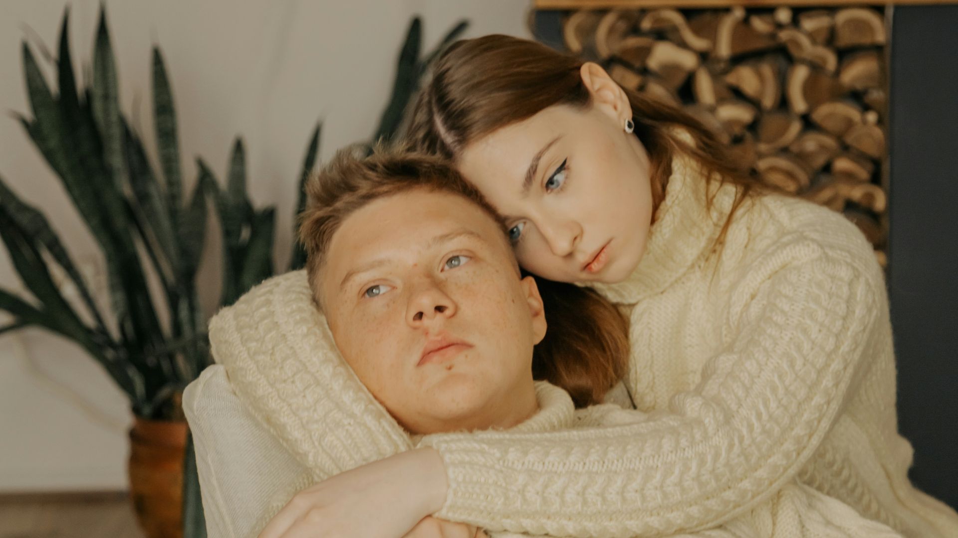 a man and a woman laying on a couch