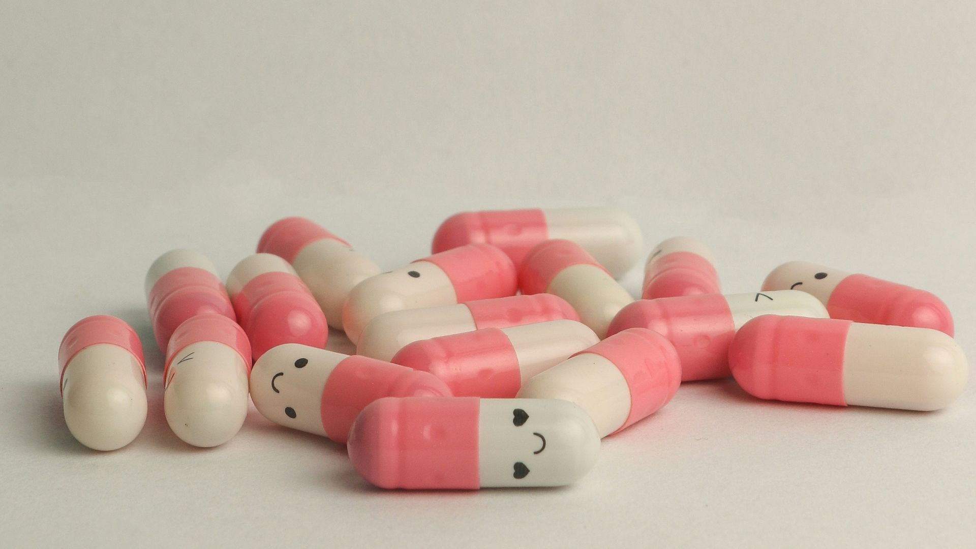 pink and white medication pill