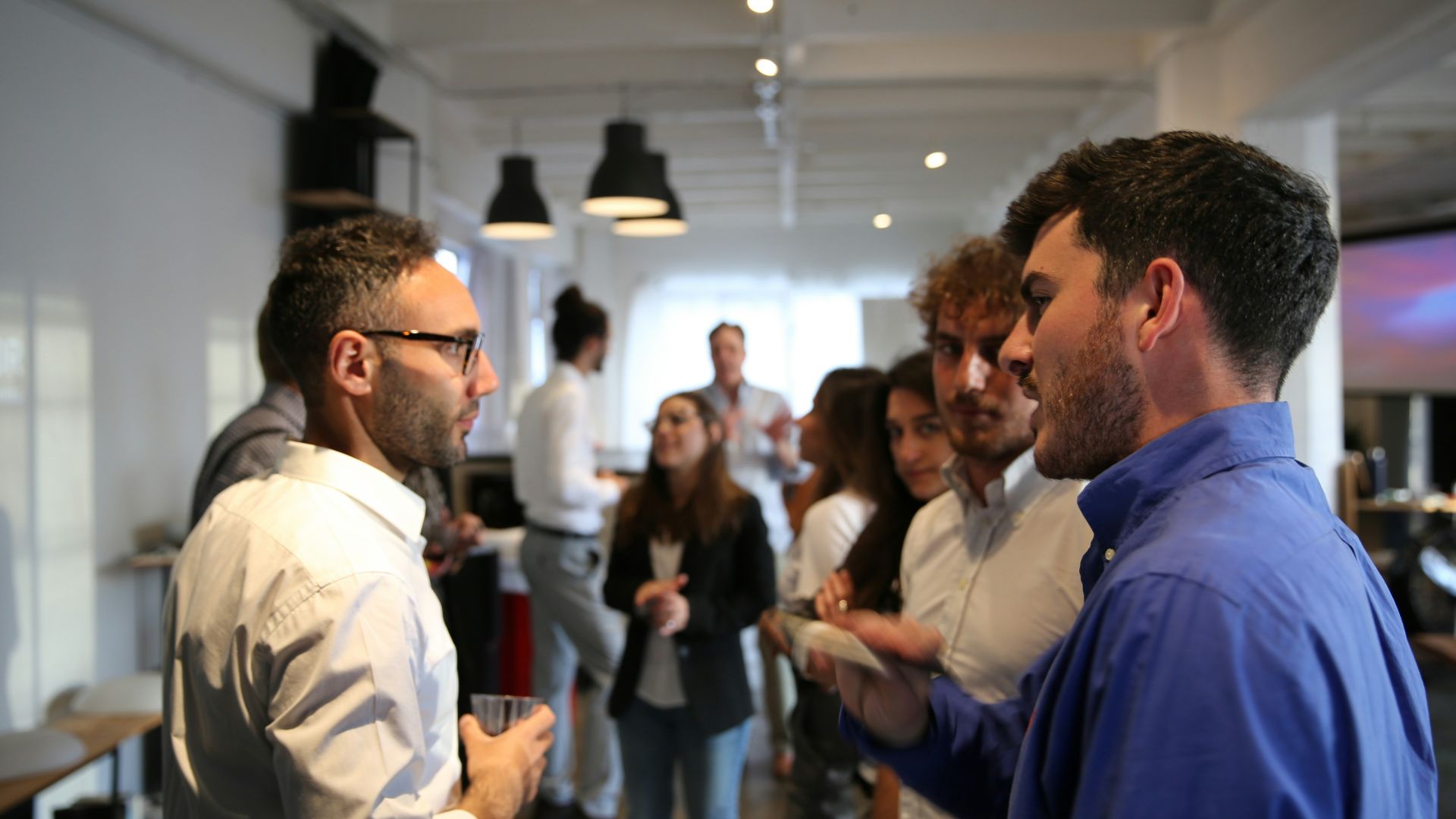 a group of people standing in a room
