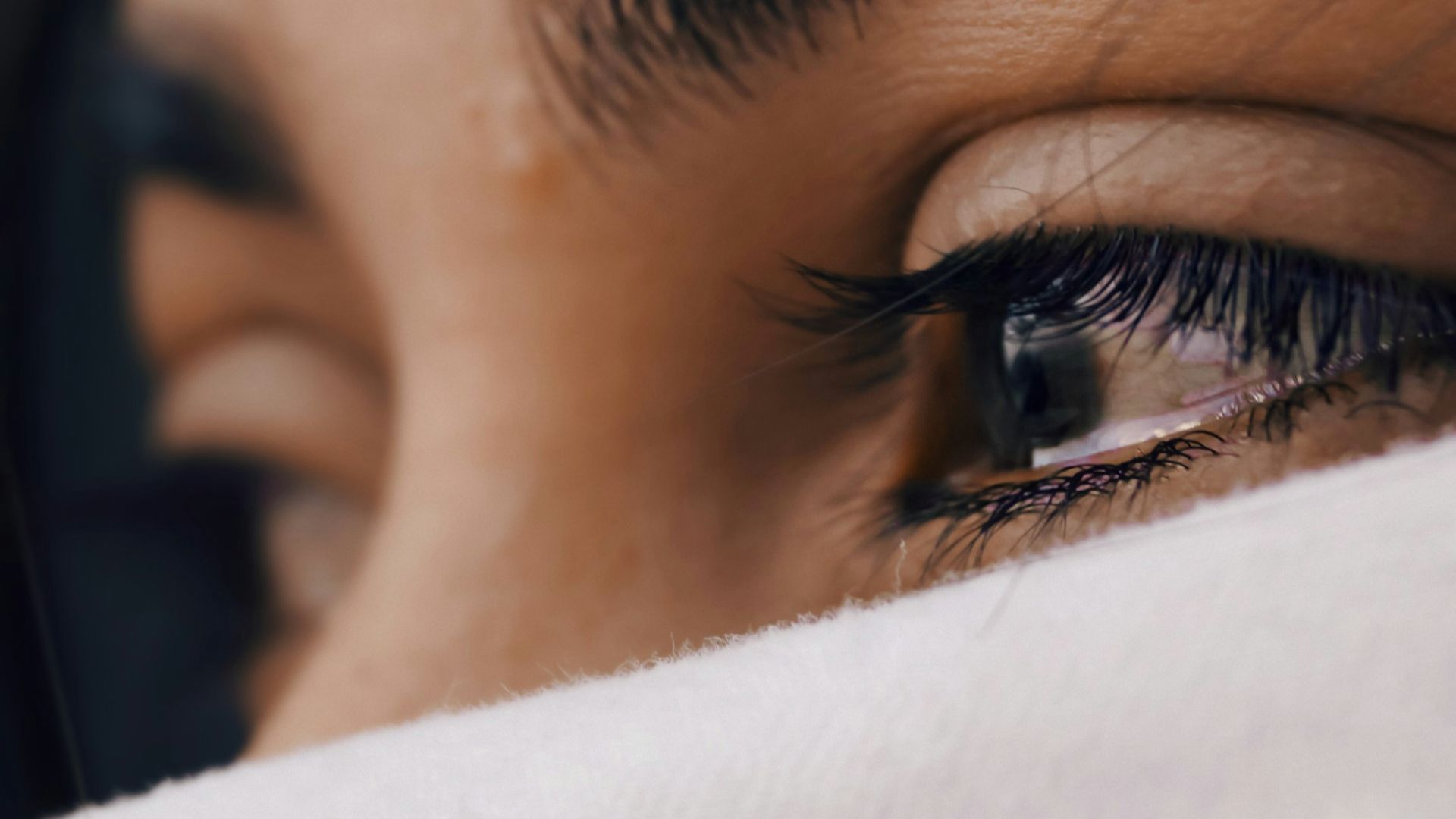 shallow focus of a woman's sad eyes