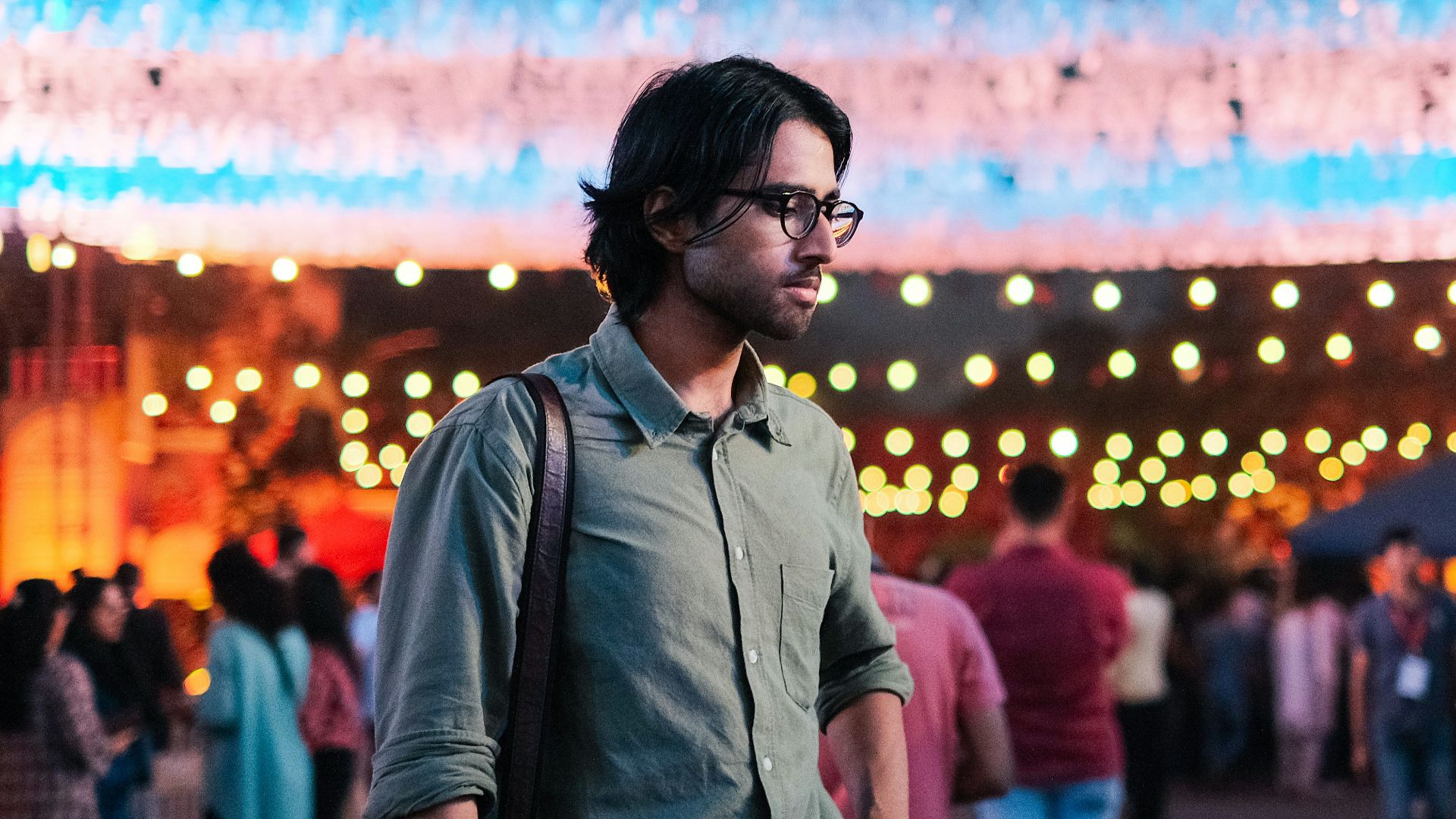 a man standing in front of a large display of lights