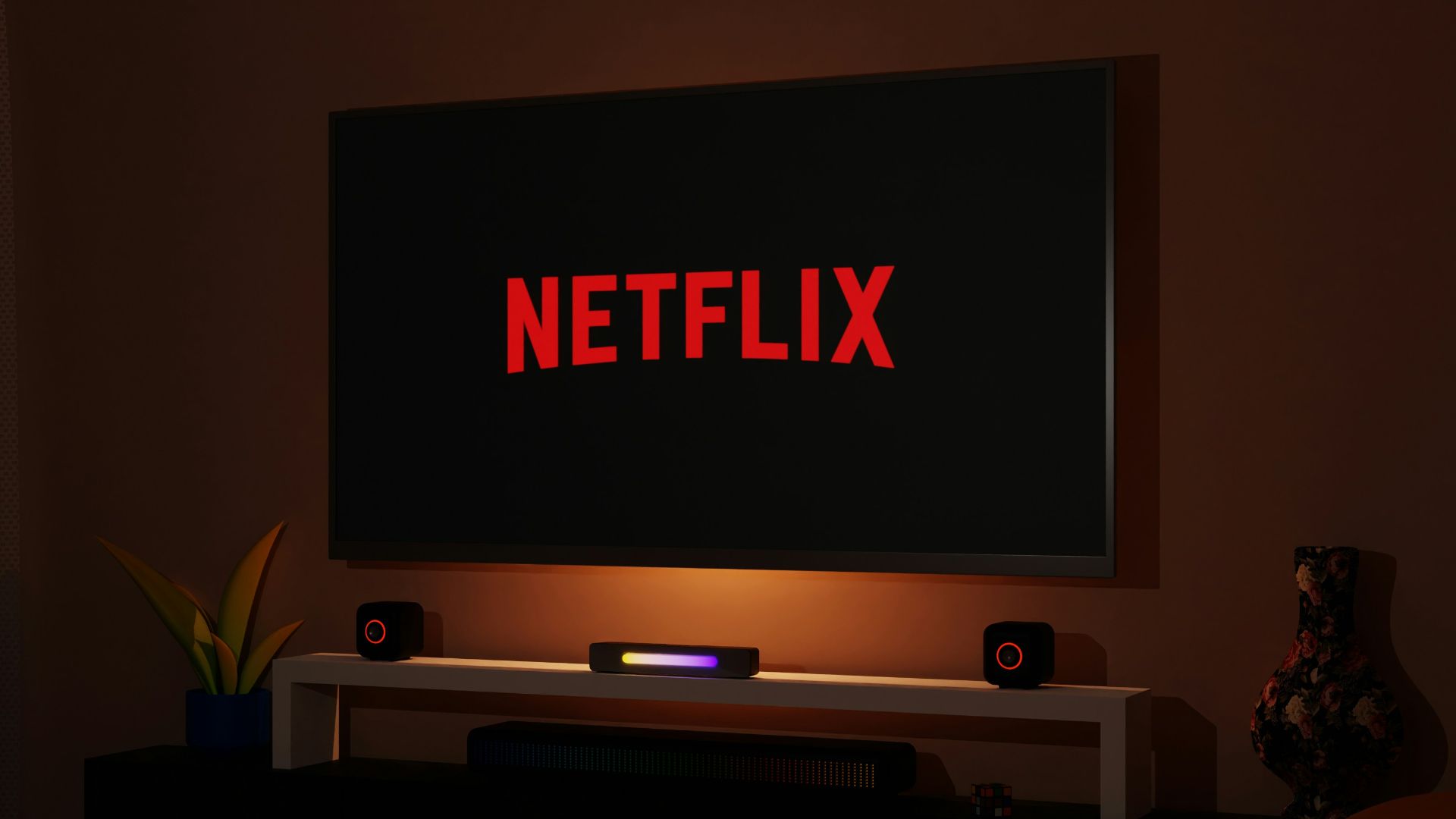 a flat screen tv sitting on top of a entertainment center