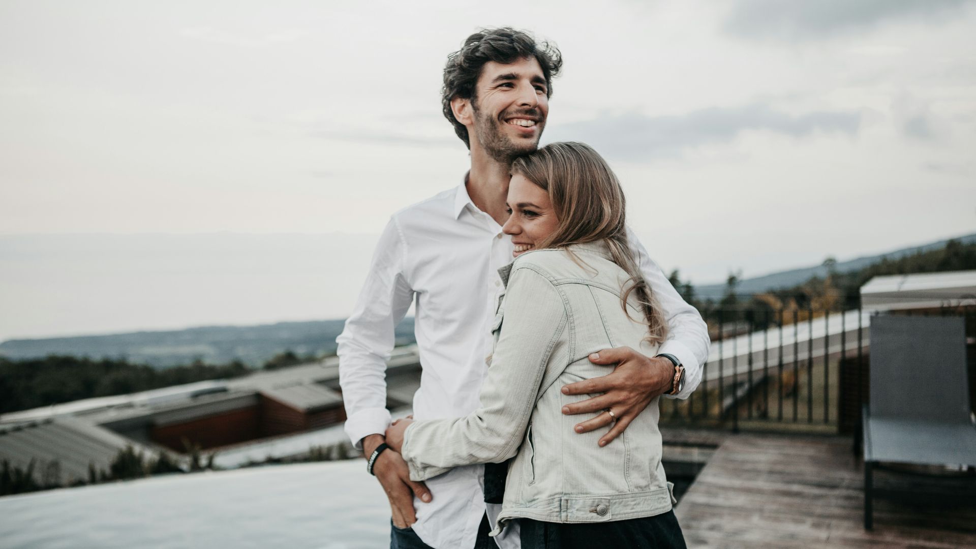 man and woman hugging each other