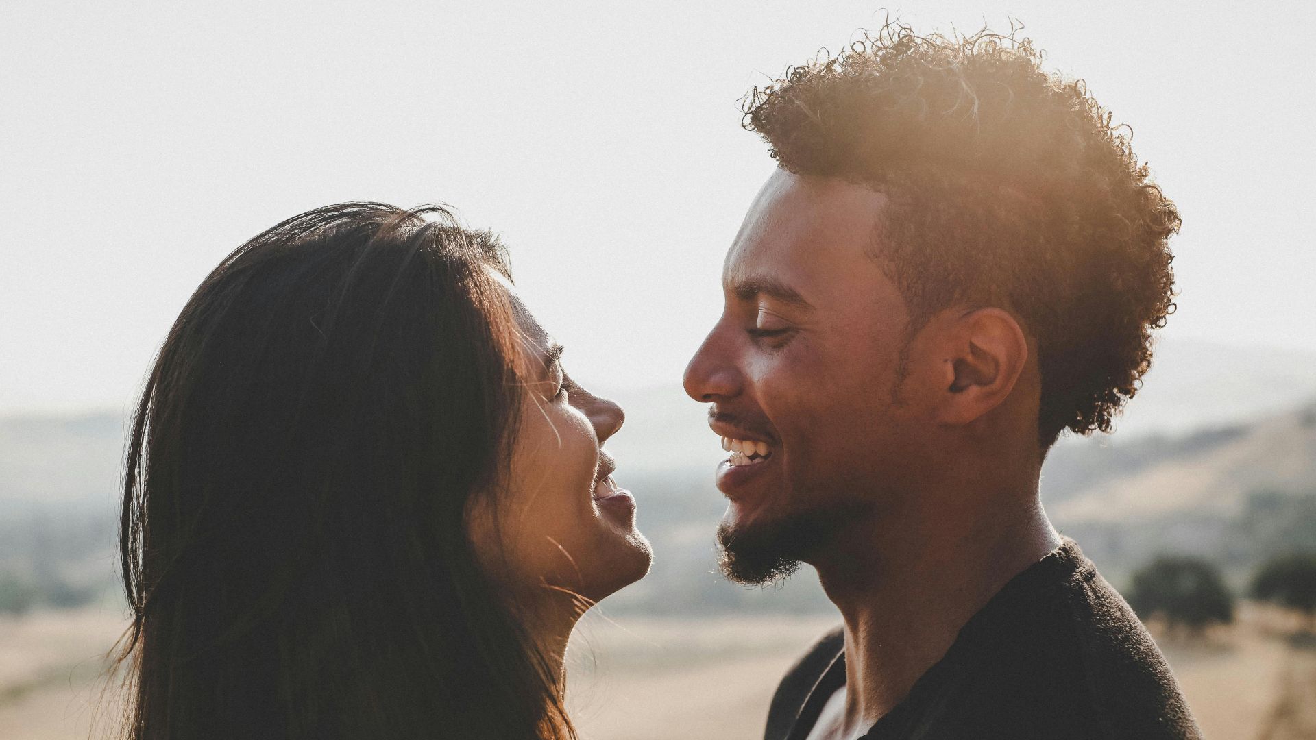 man and woman facing