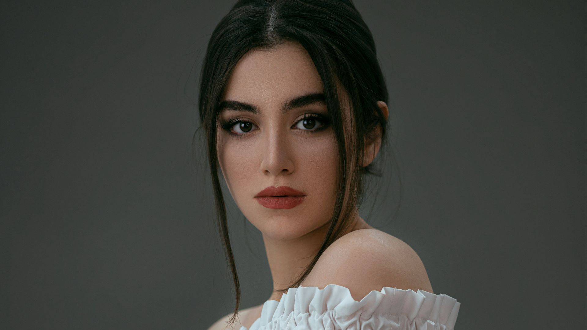 woman in white off shoulder dress