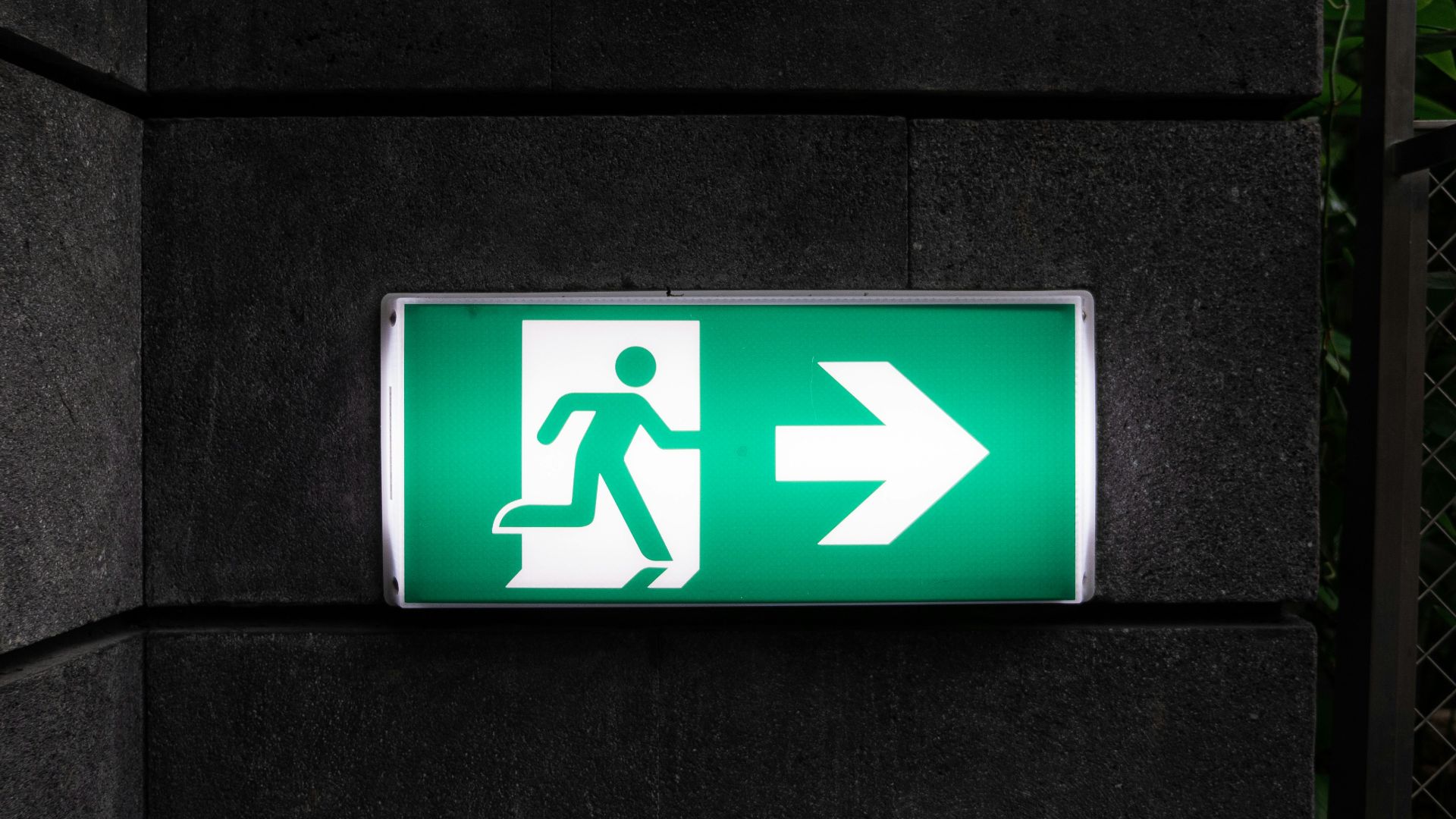 white and green Exit sign