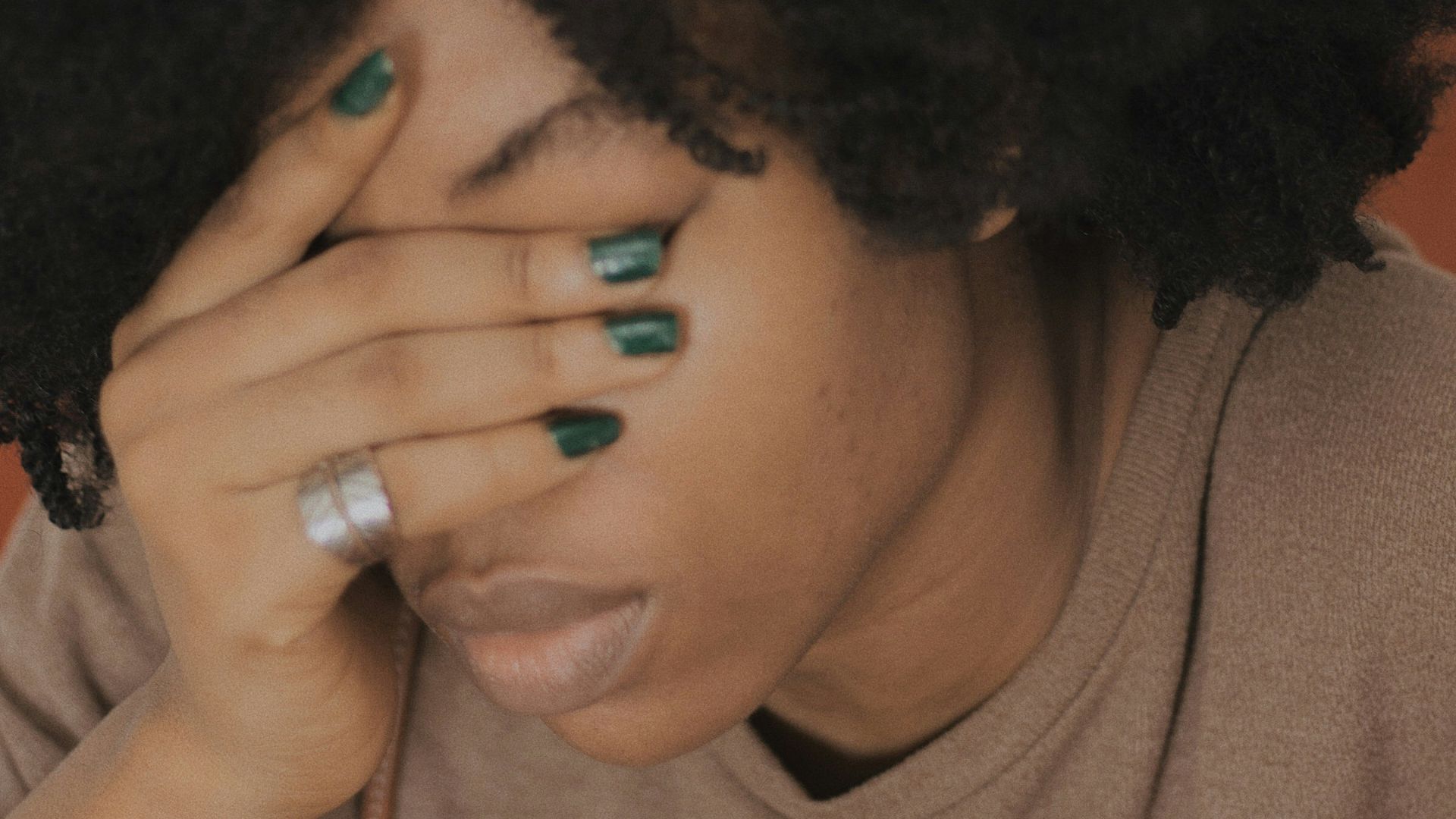 woman in brown crew neck shirt