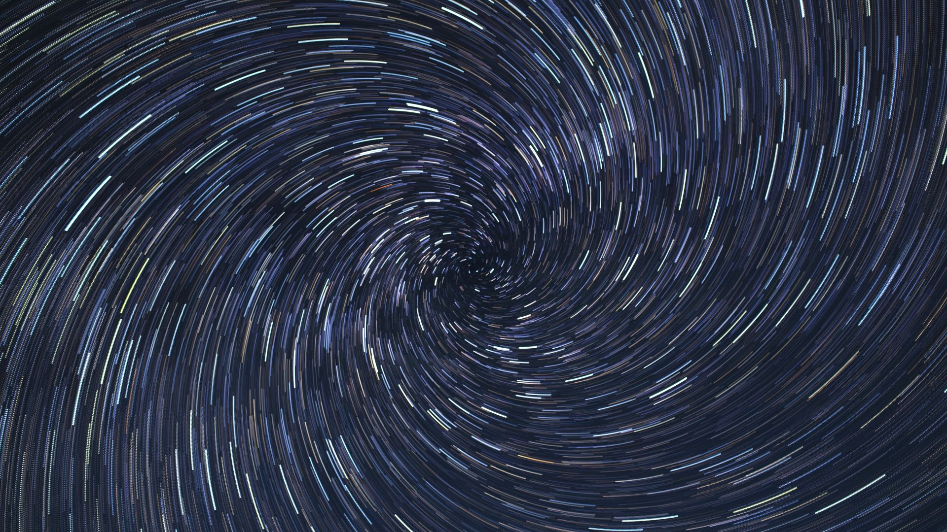 a spiral of stars in the night sky