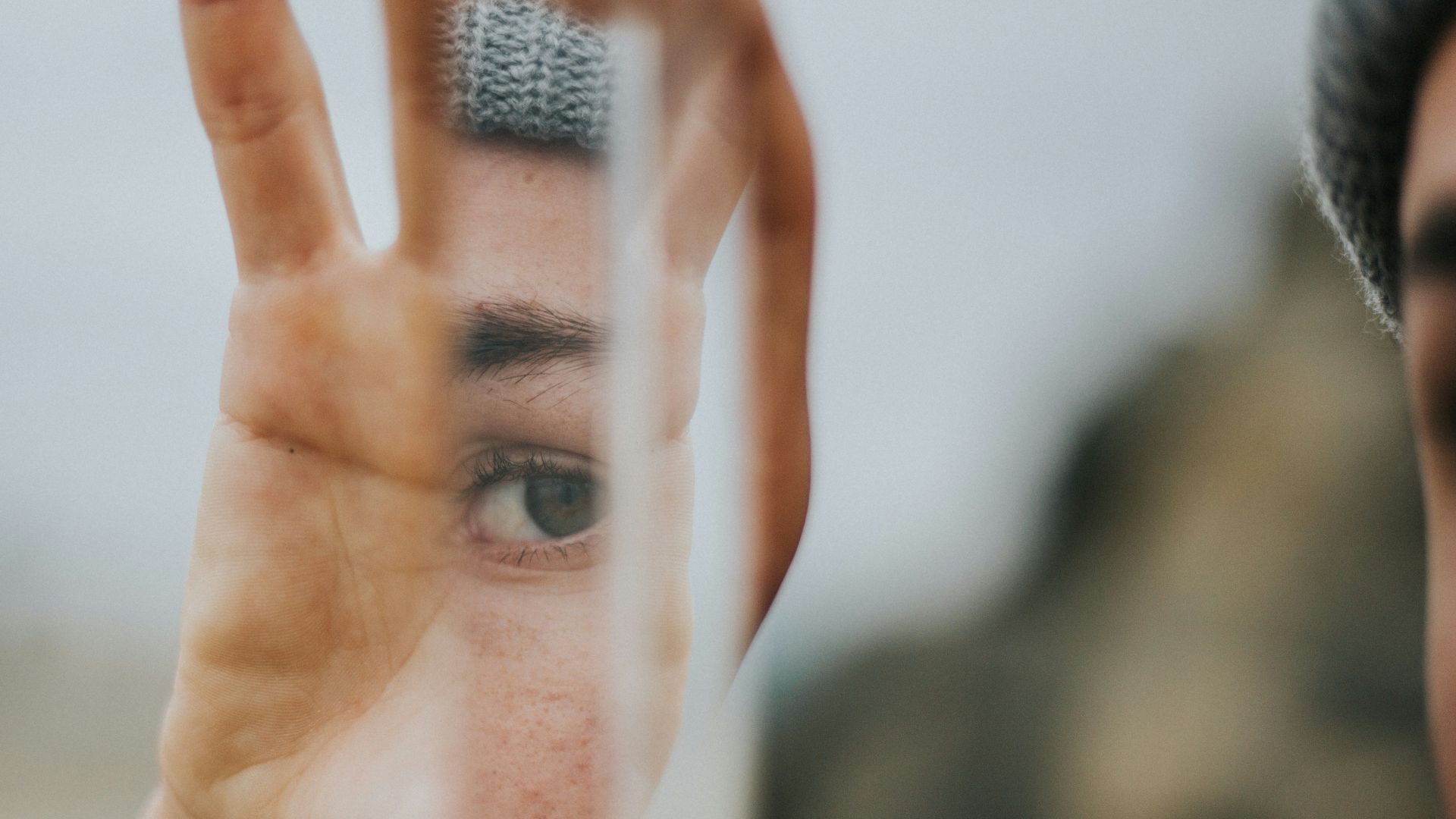shallow focus of person holding mirror