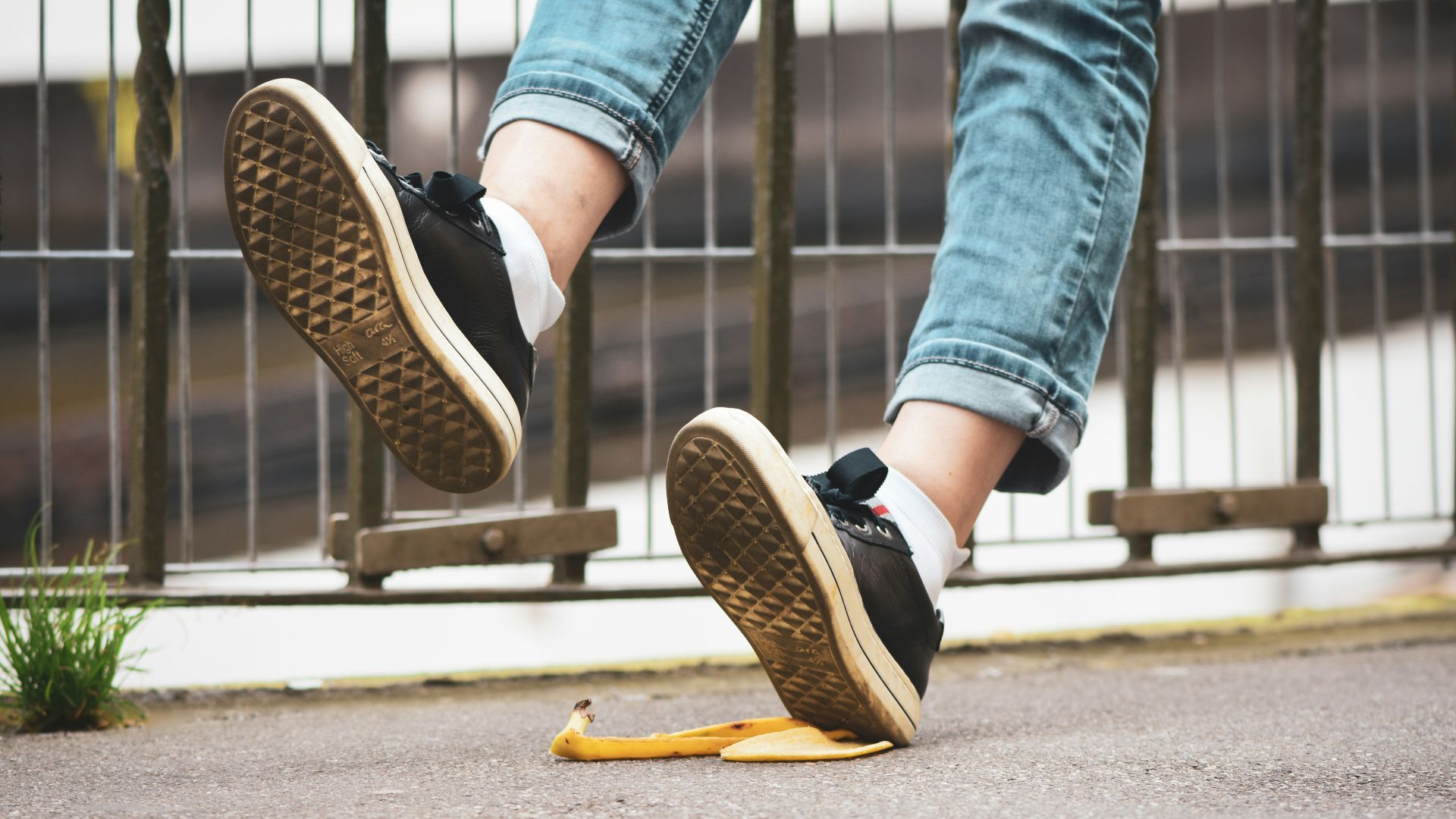 a person stepping on a banana peel on the ground