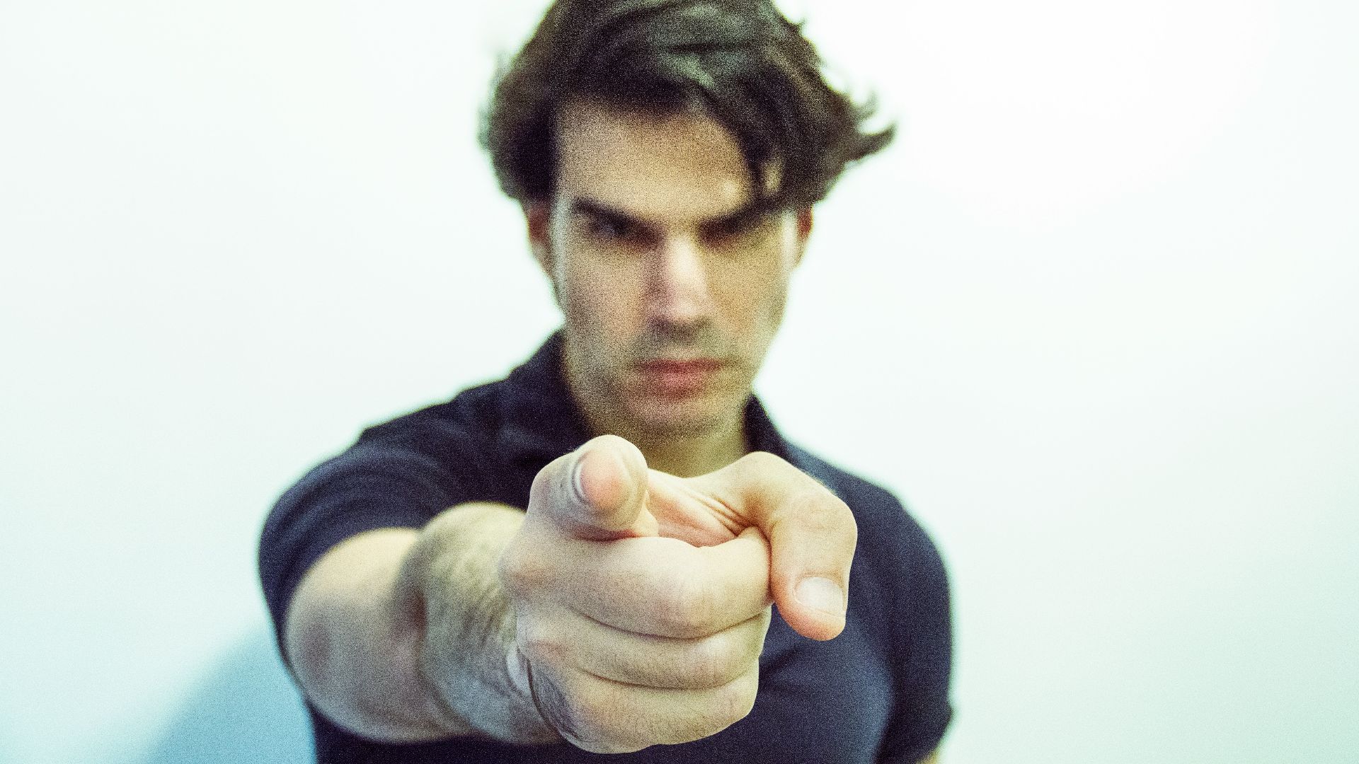 man pointing at camera