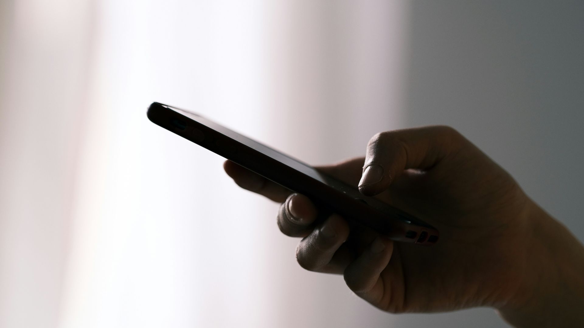 person holding black android smartphone