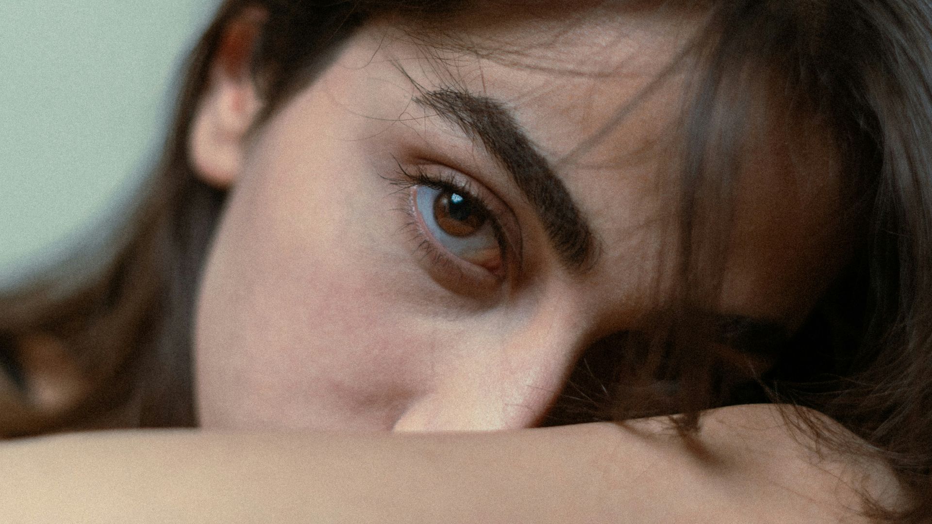 a woman with her eyes wide open