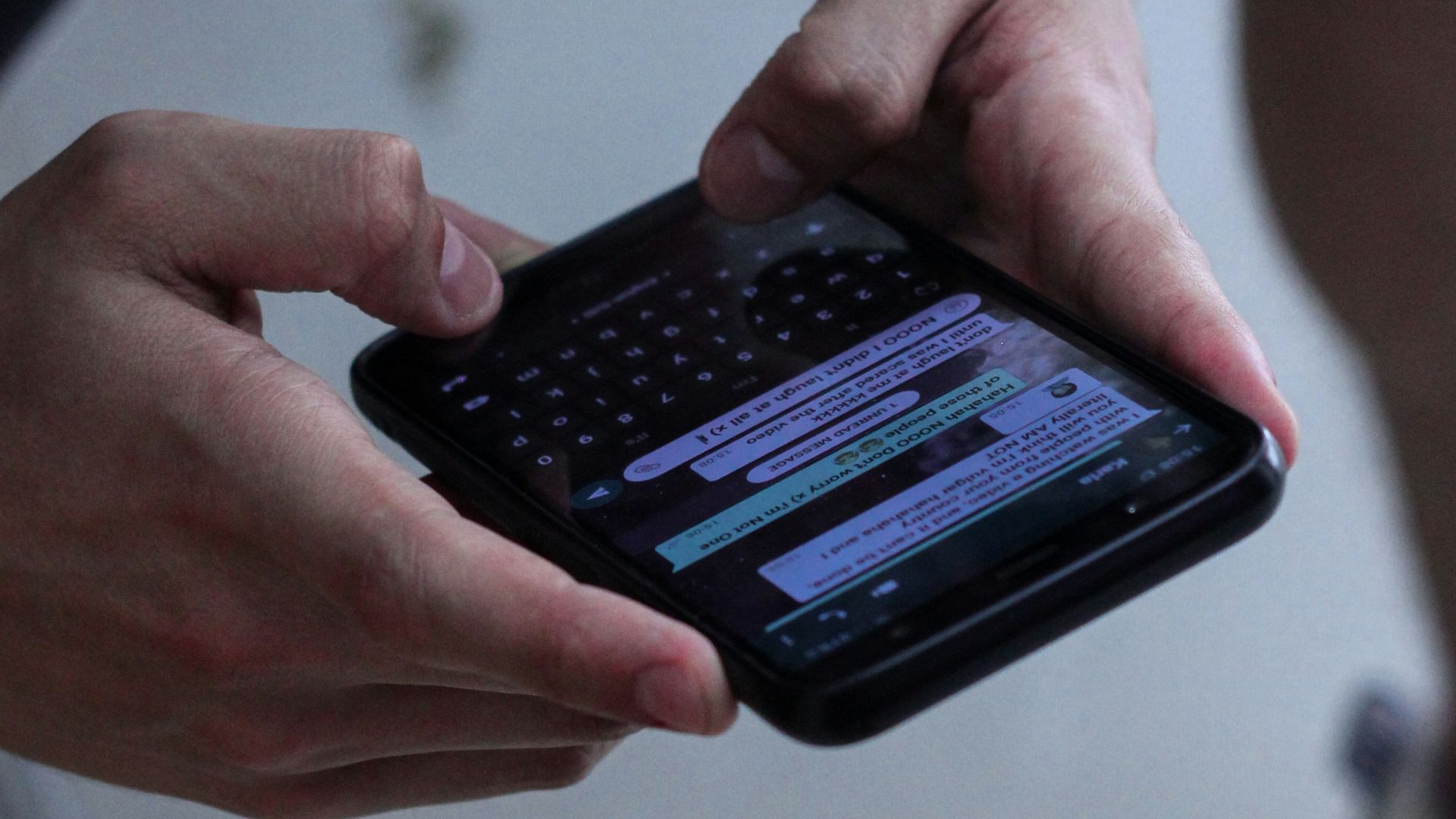 person holding black iphone 4