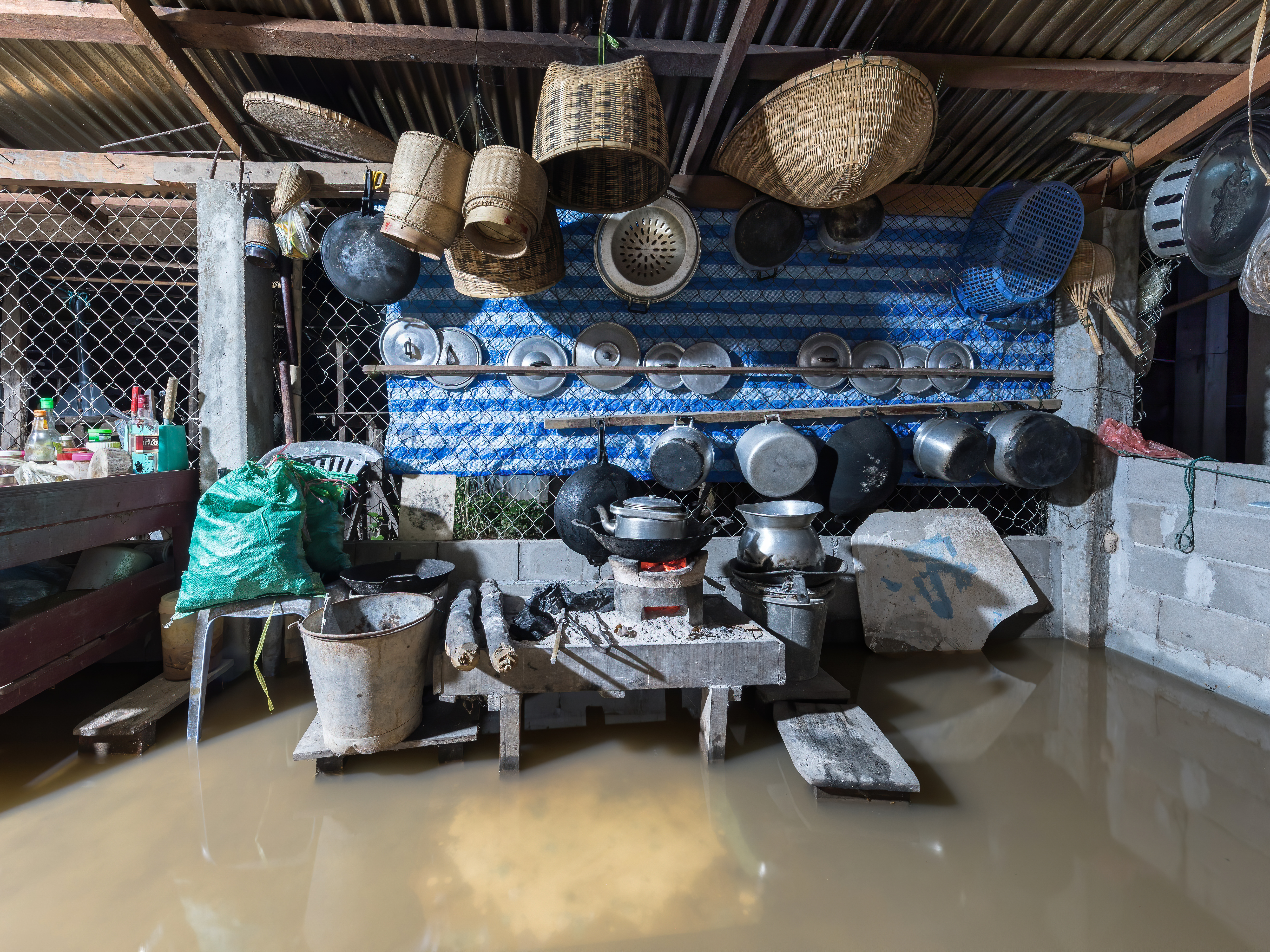 File:Interior view of a submerged kitchen in the muddy water of the Mekong, at night, during a flood in Don Det, Laos.jpg