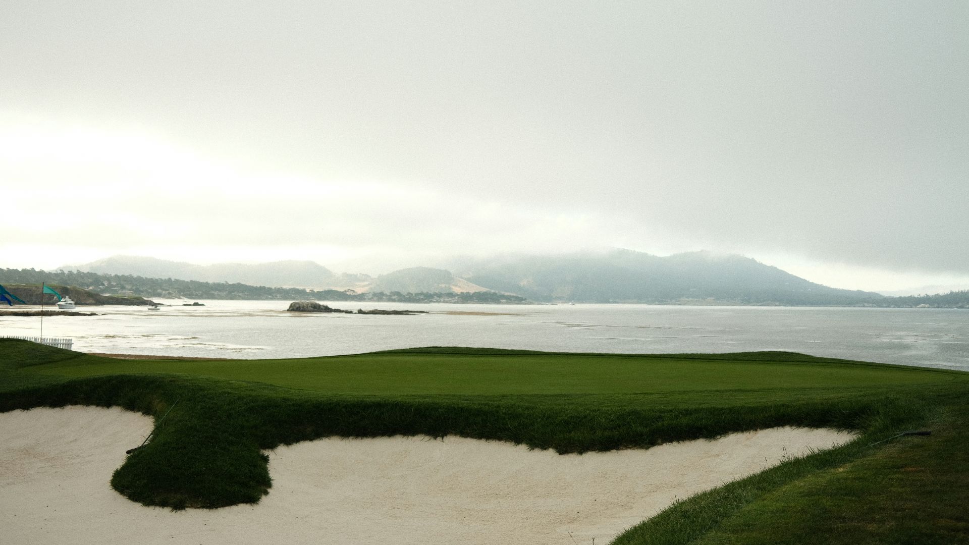 a golf course with a view of the ocean