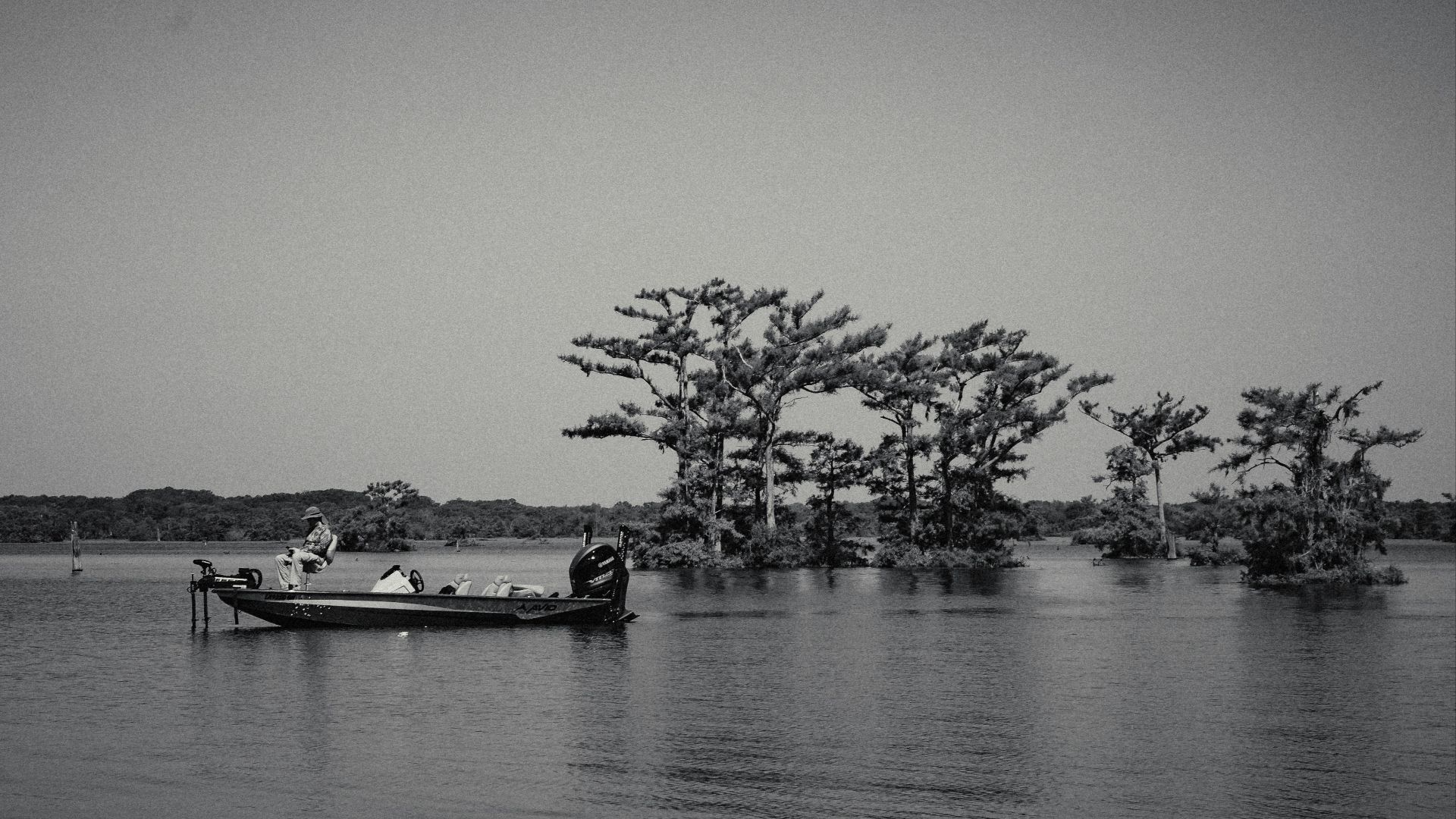 A boat floating on top of a large body of water