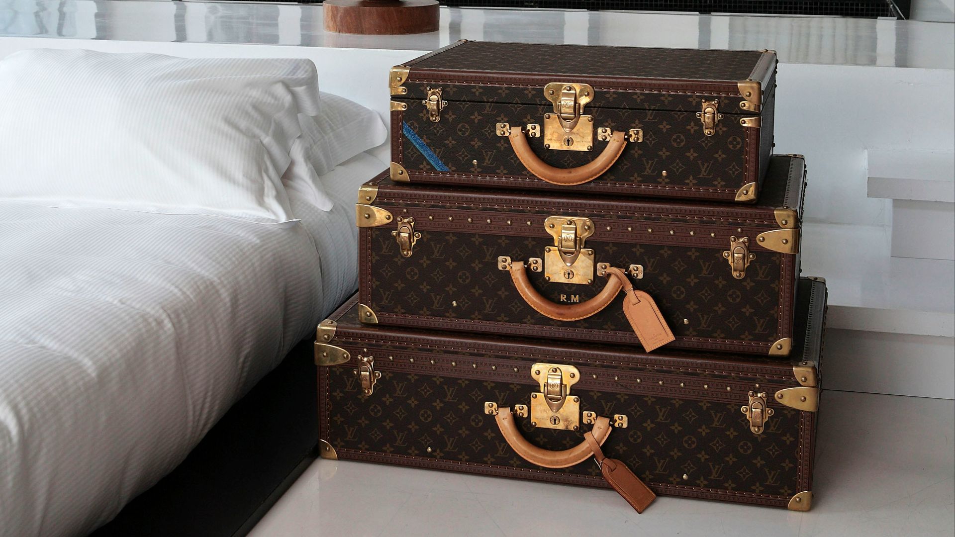 a couple of suitcases sitting on top of a white floor