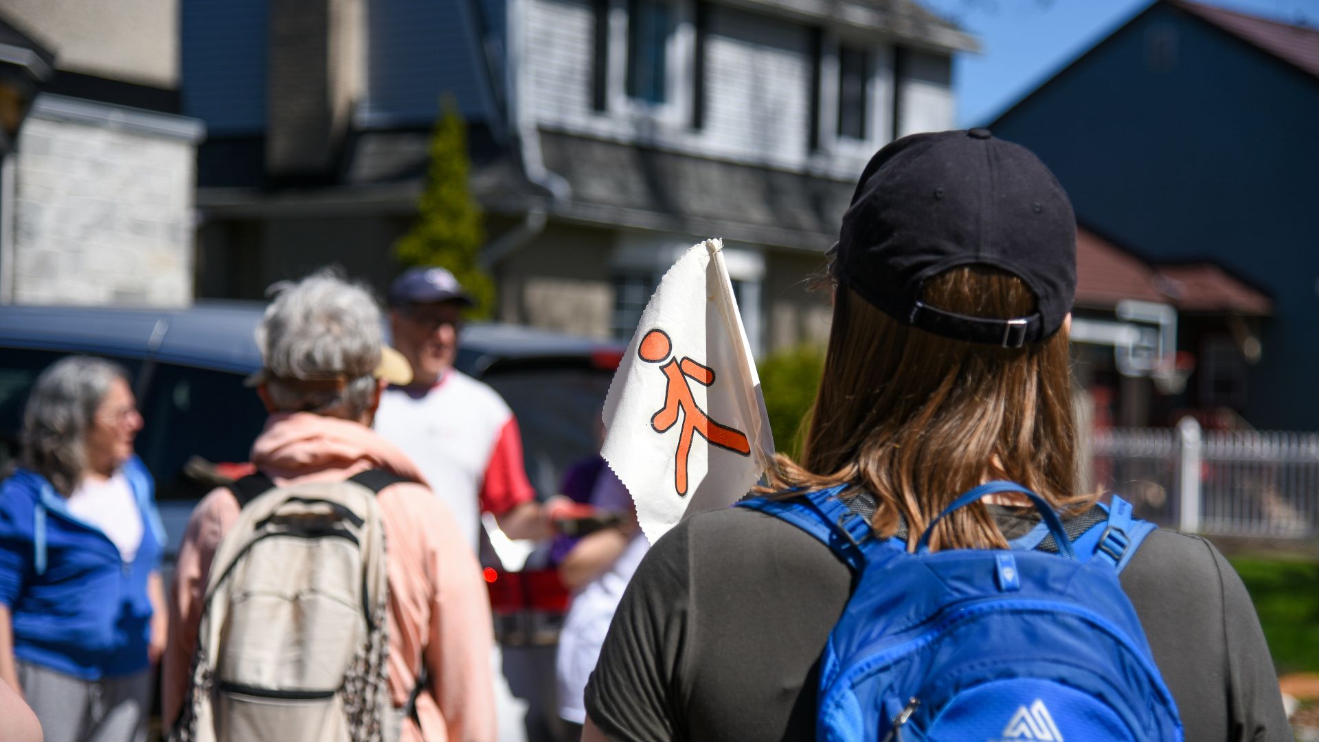 a group of people walking down a street