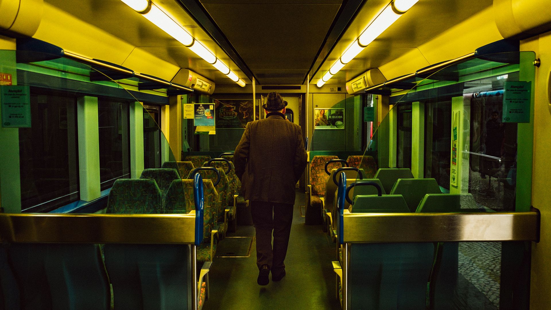 man walking inside train