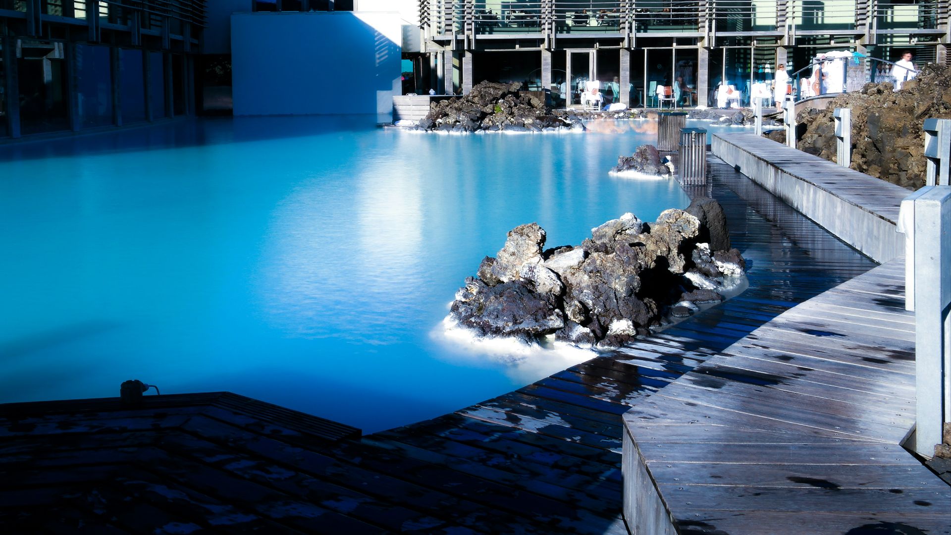 blue and white building near body of water during daytime
