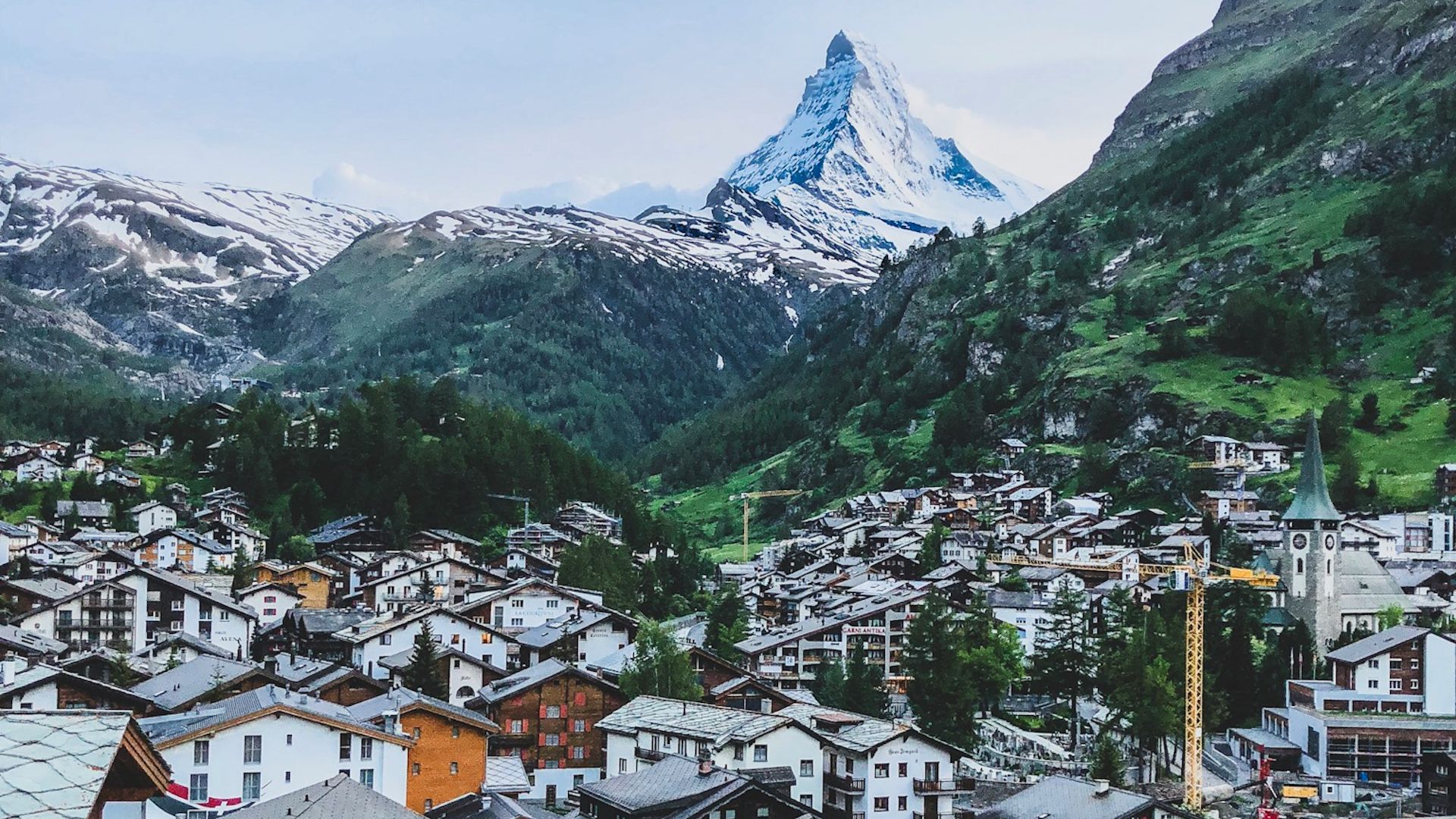 aerial photography of houses near mountains at daytime