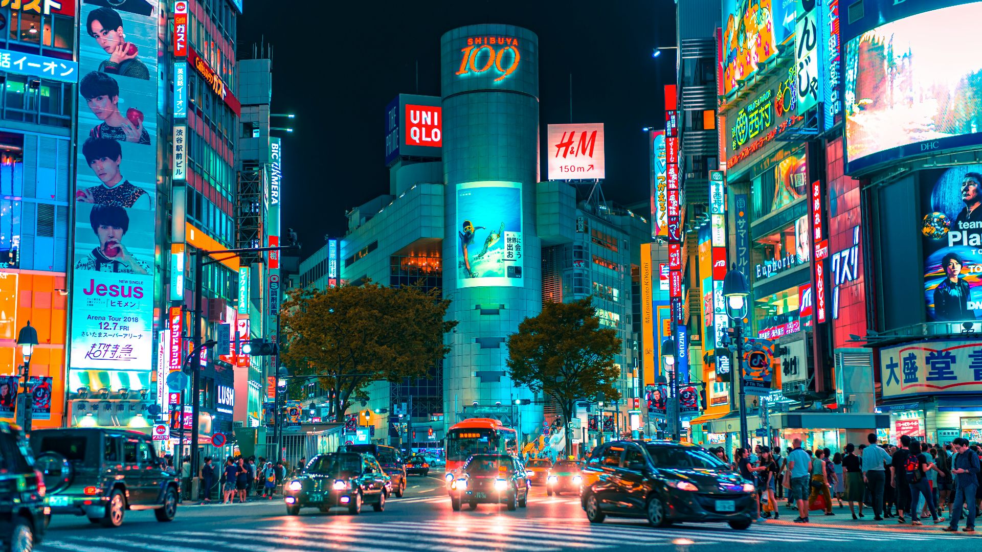 people gathered outside buildings and vehicles