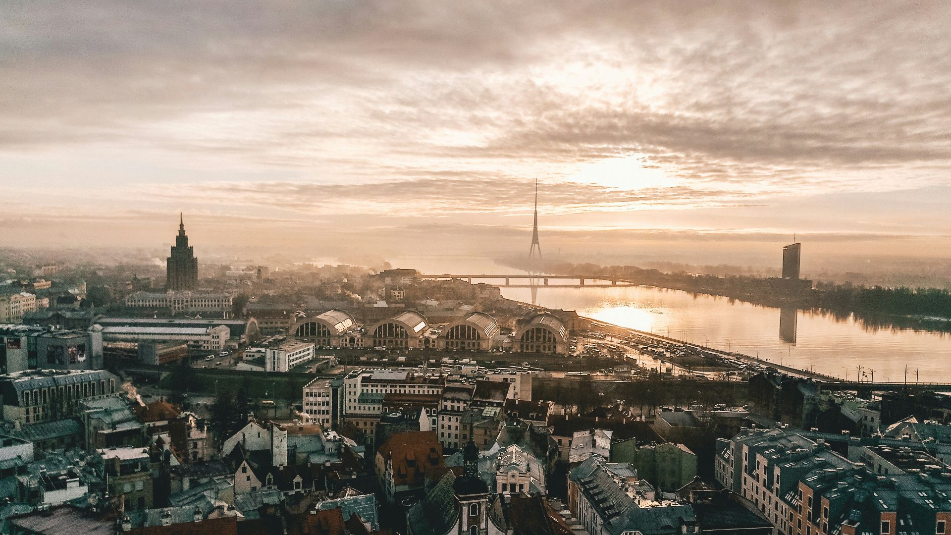 aerial photo of city under cloudy sky