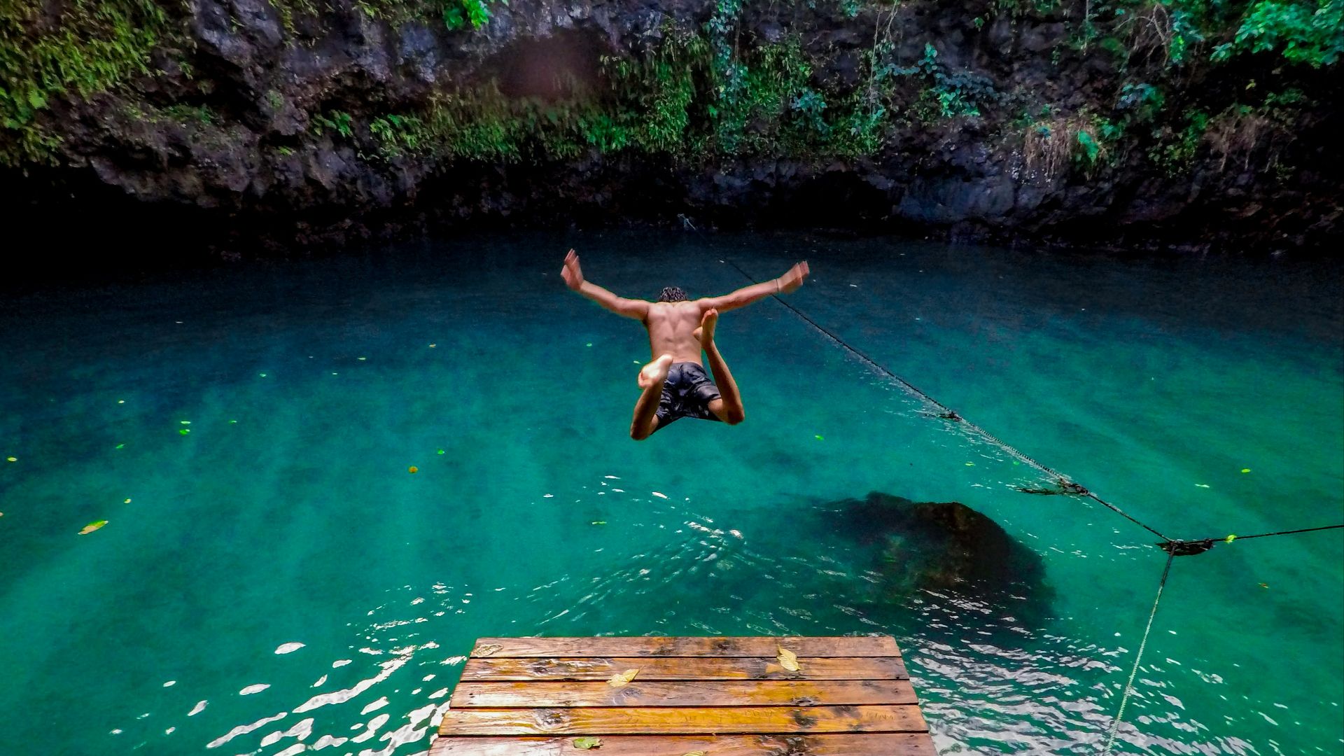 man diving in water