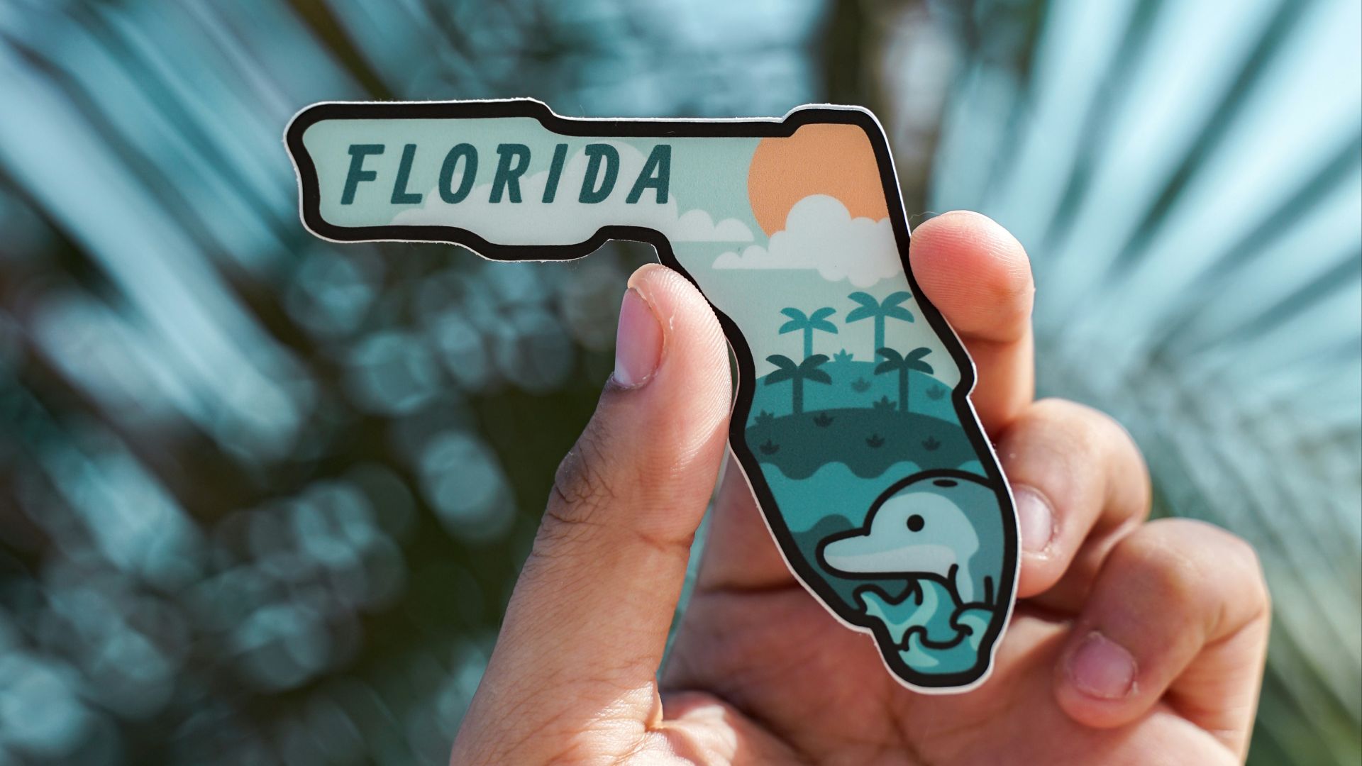 person holding white and black iphone case