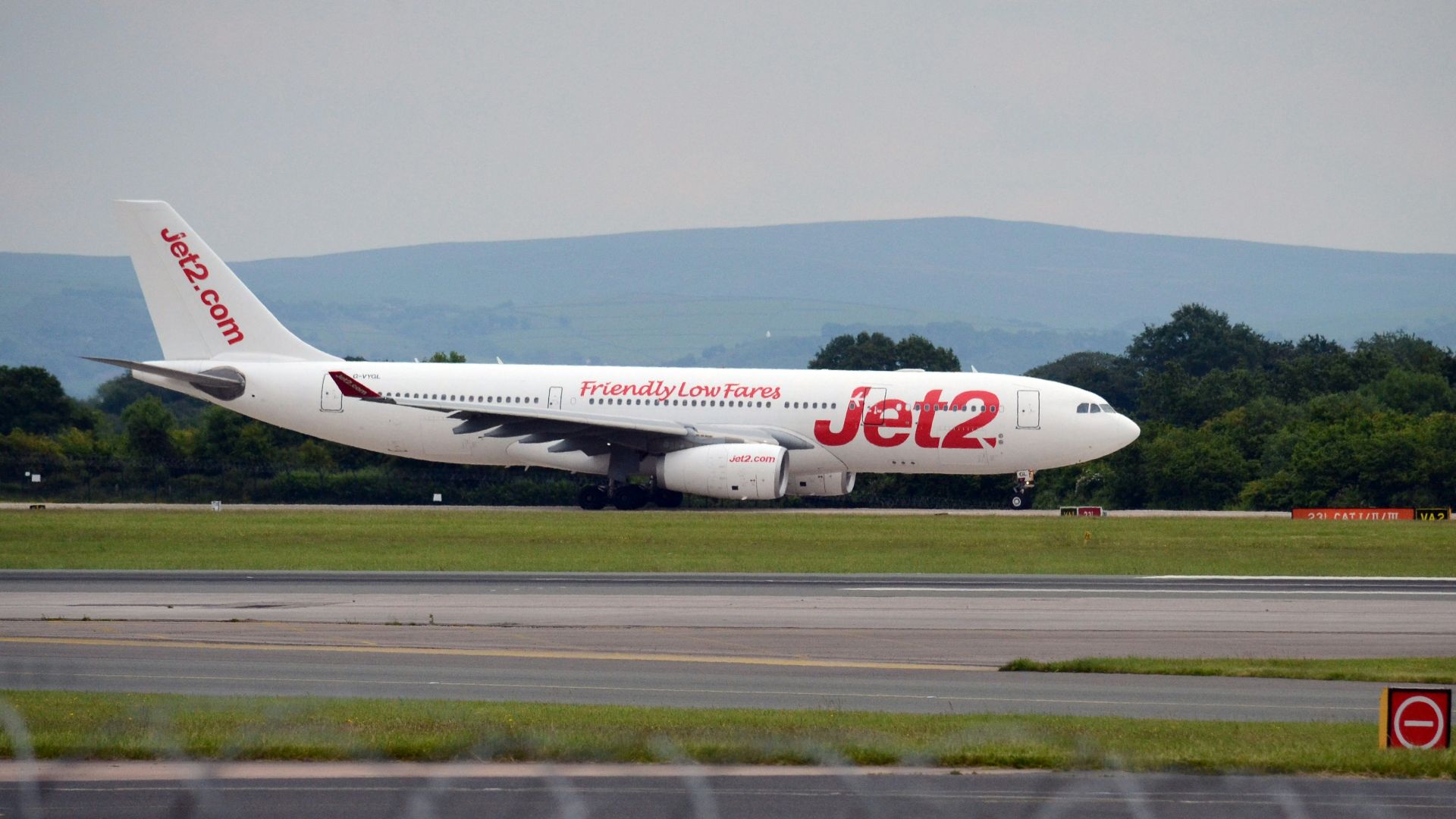 a large jetliner sitting on top of an airport runway
