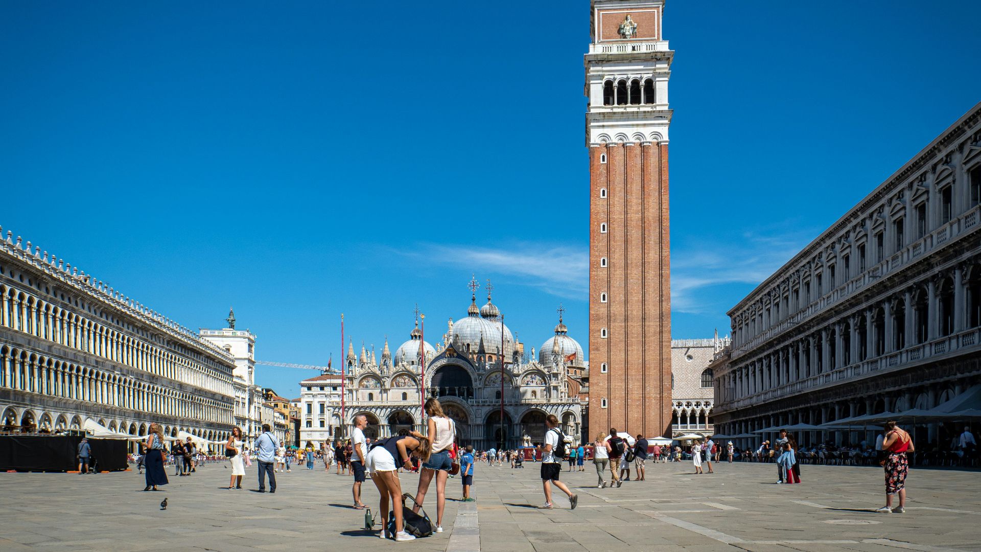 a tall clock tower towering over a city