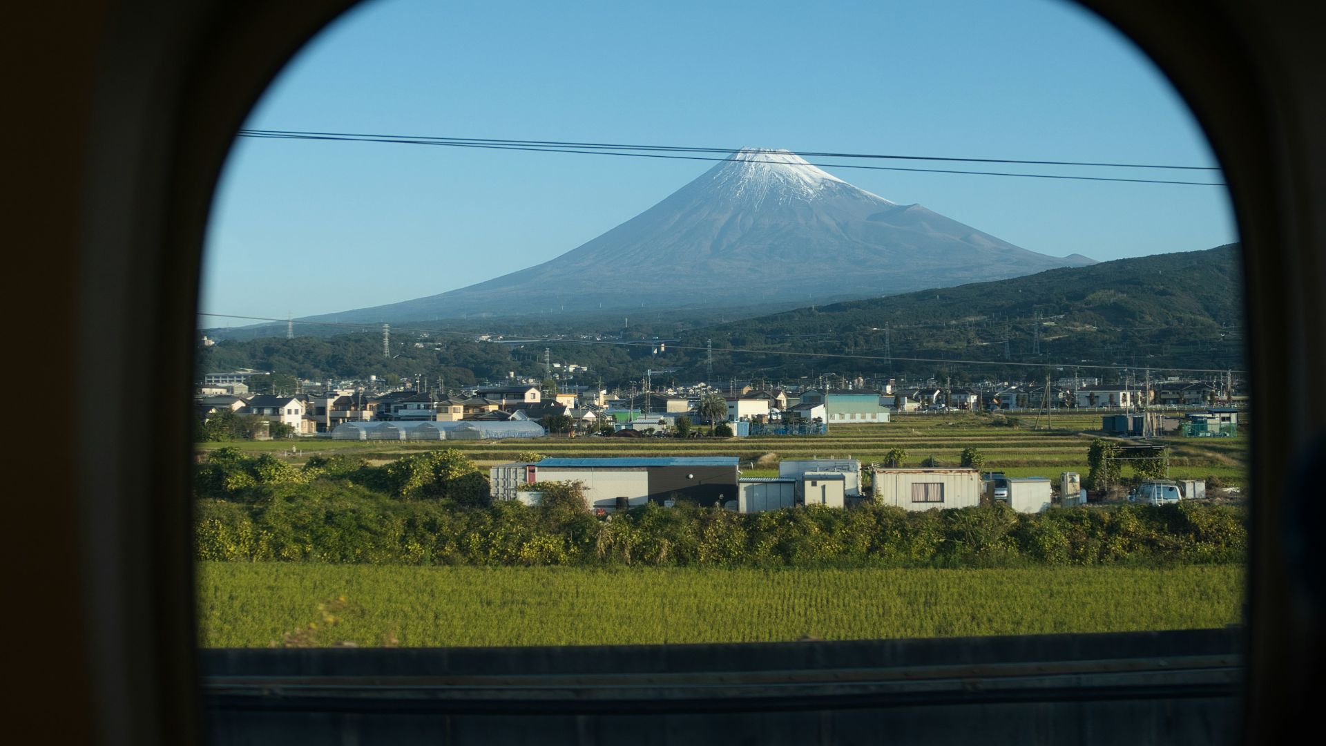 a view of a mountain from a train window