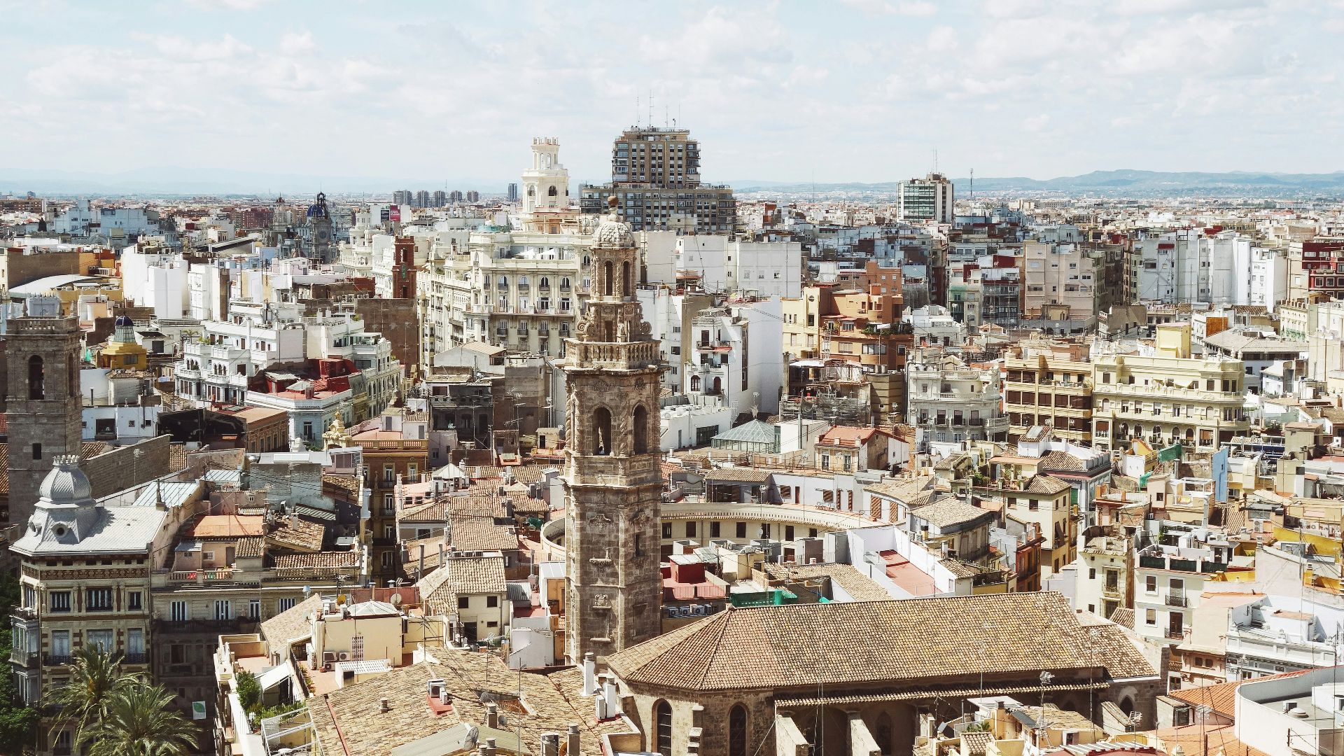 gray concrete tower beside house