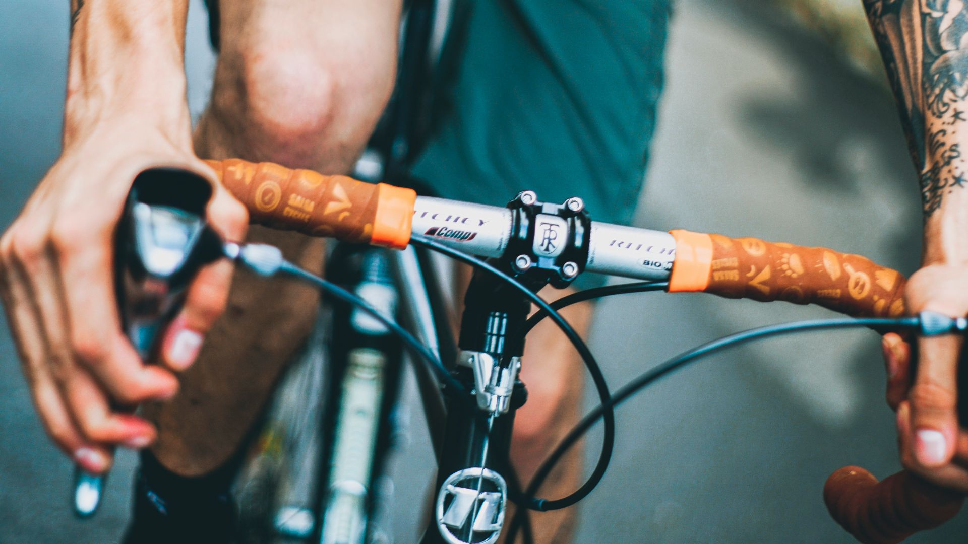 man riding black and gray bicycle photo