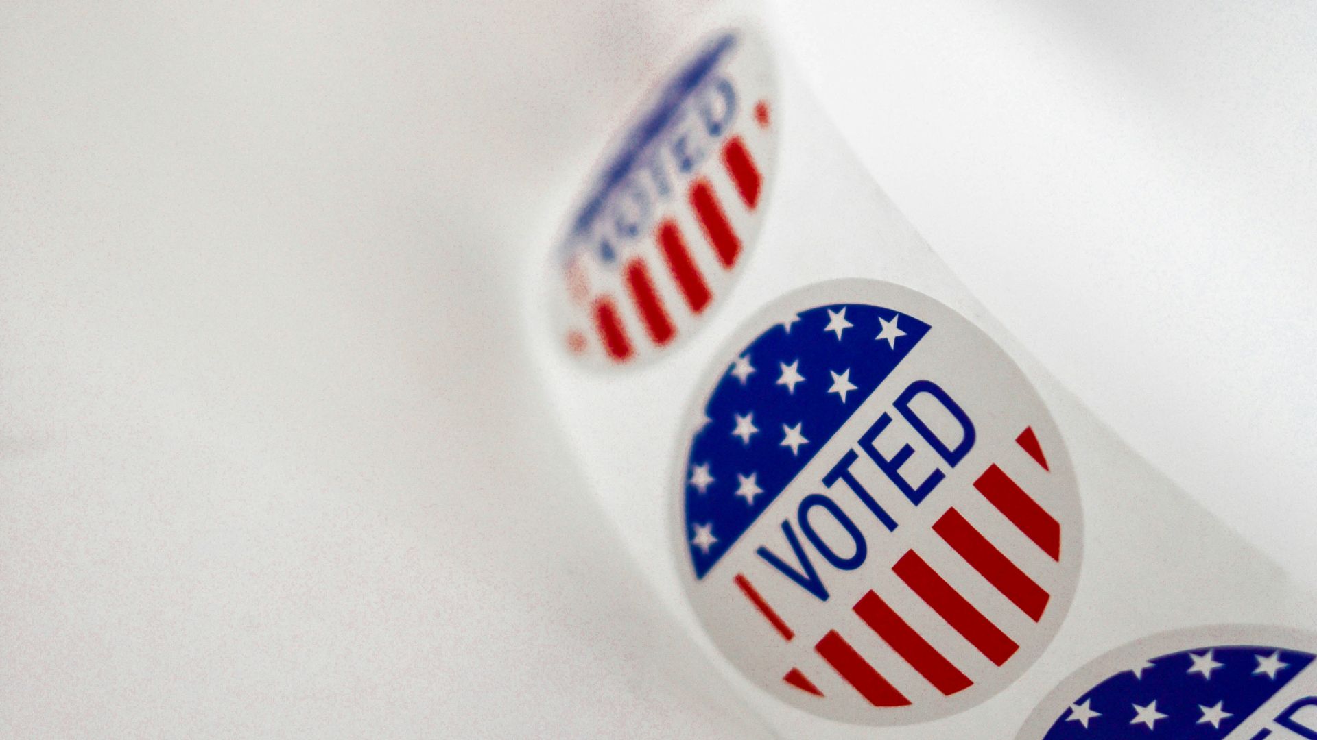 a close up of a toothbrush with the word vote written on it