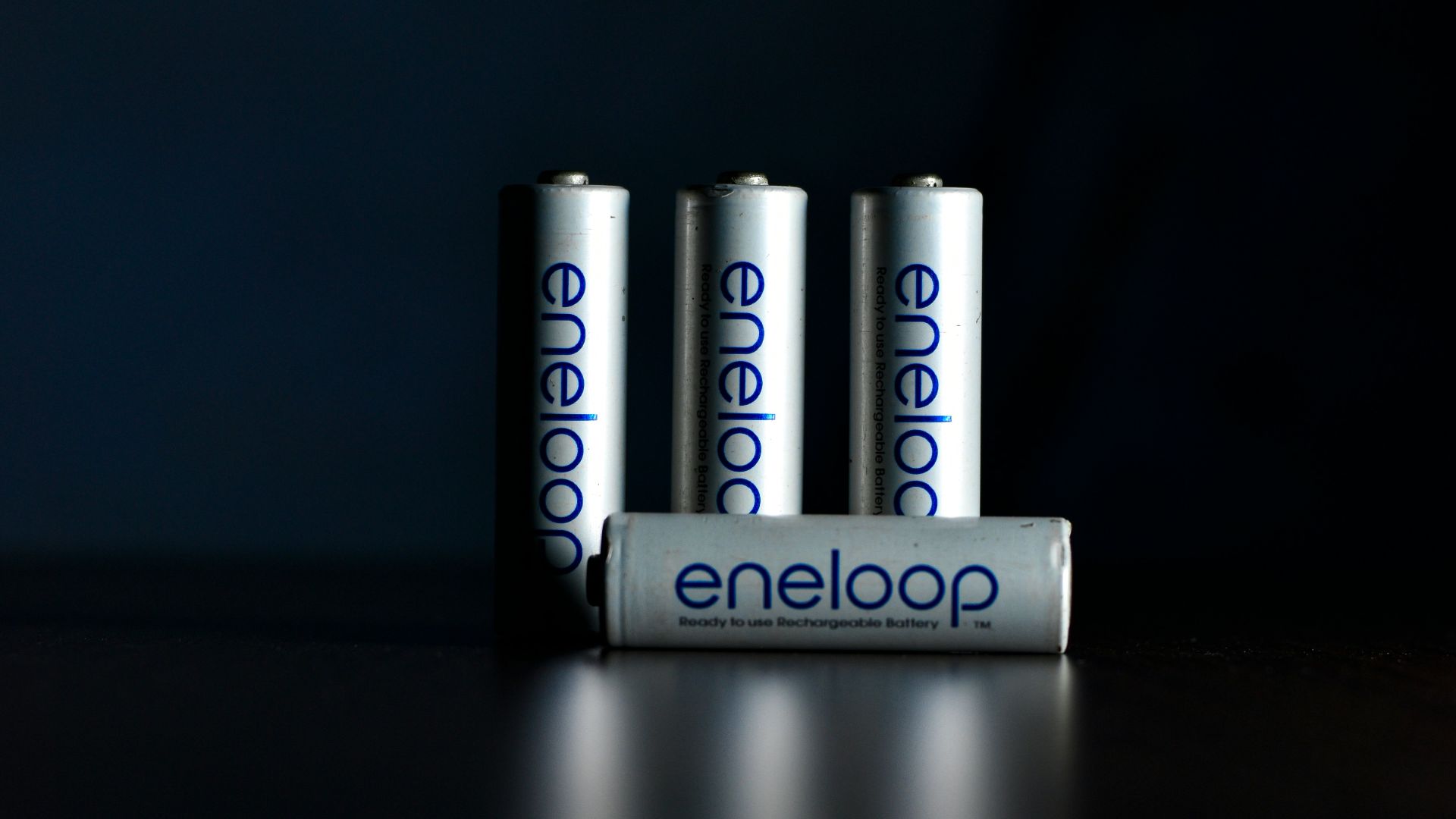 a group of four batteries sitting on top of a table