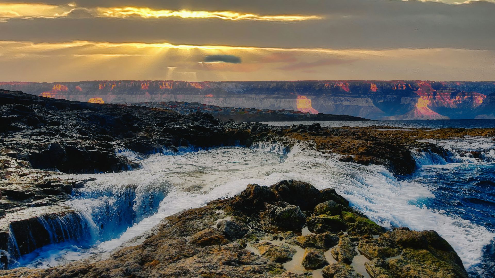 the sun shines through the clouds over a river