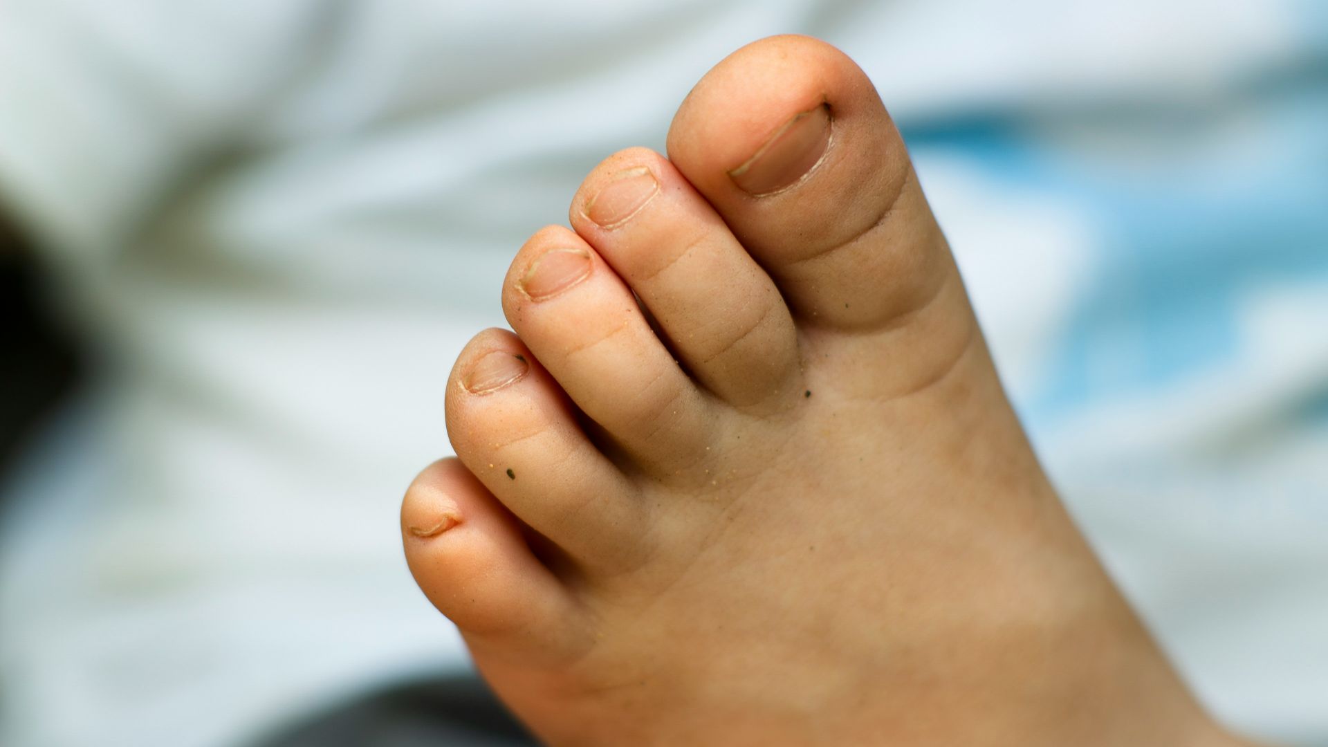 person putting left foot on lap of another person