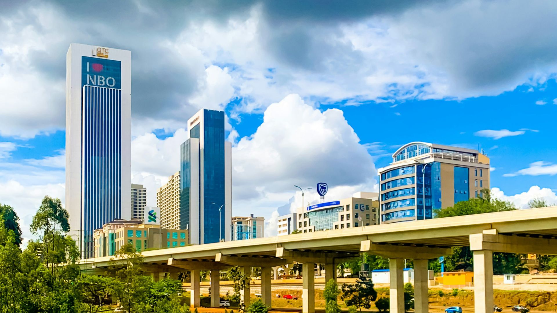 a bridge with a city in the background