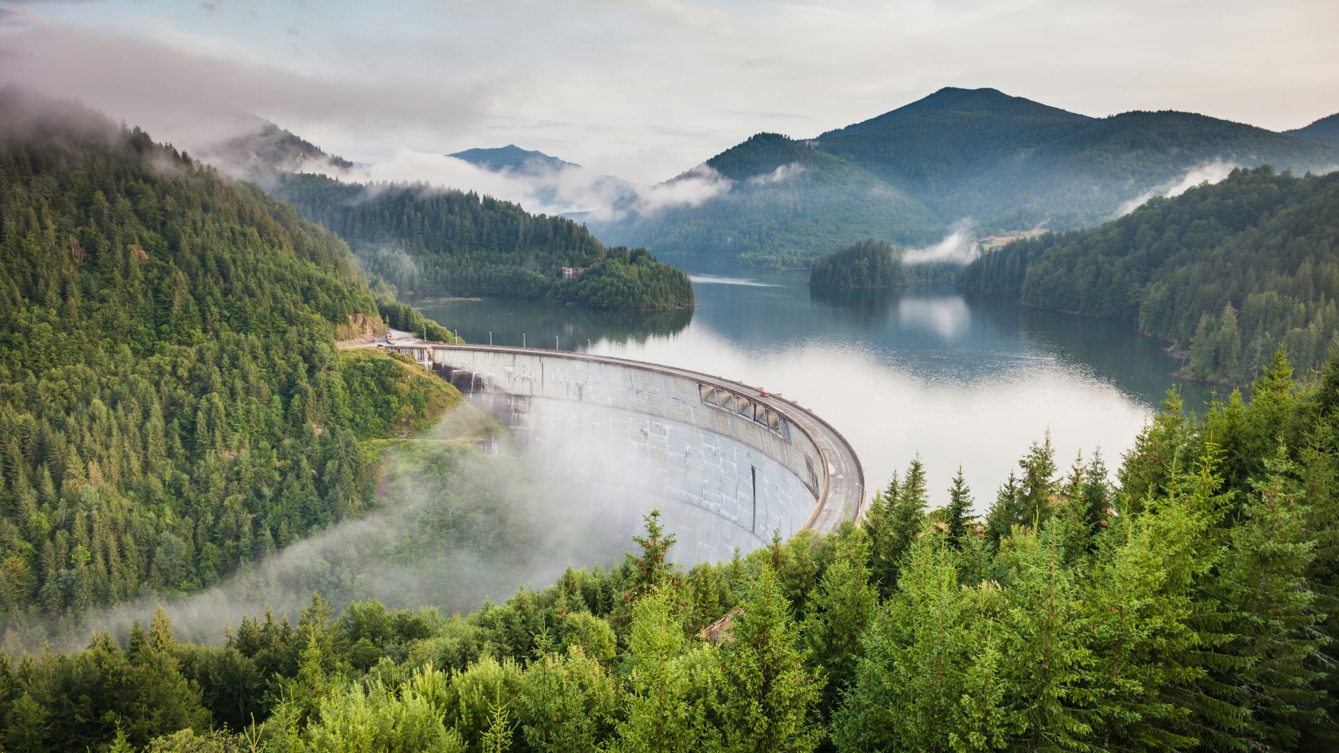 white bridge between mountains
