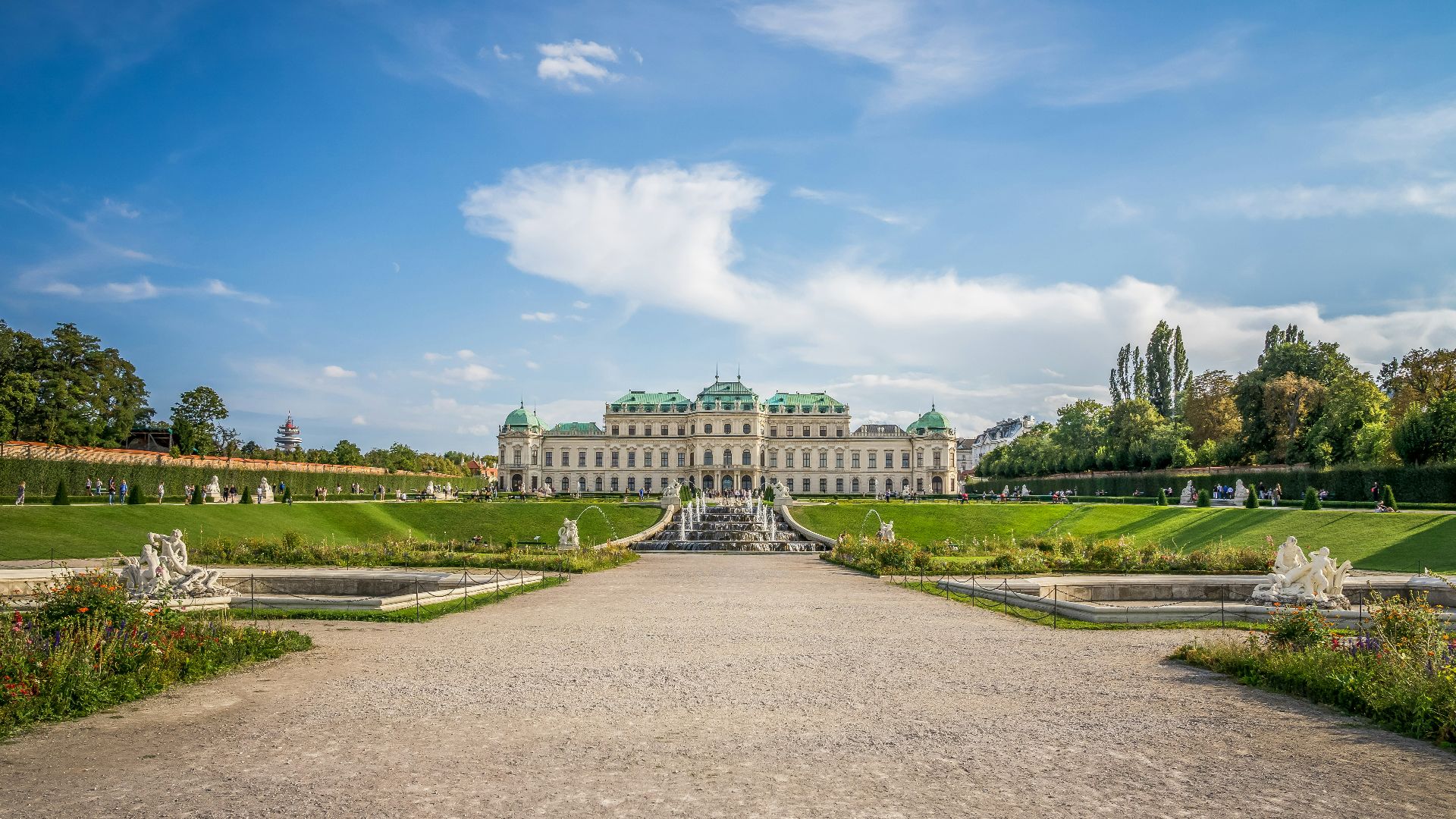 a large building with a fountain in front of it