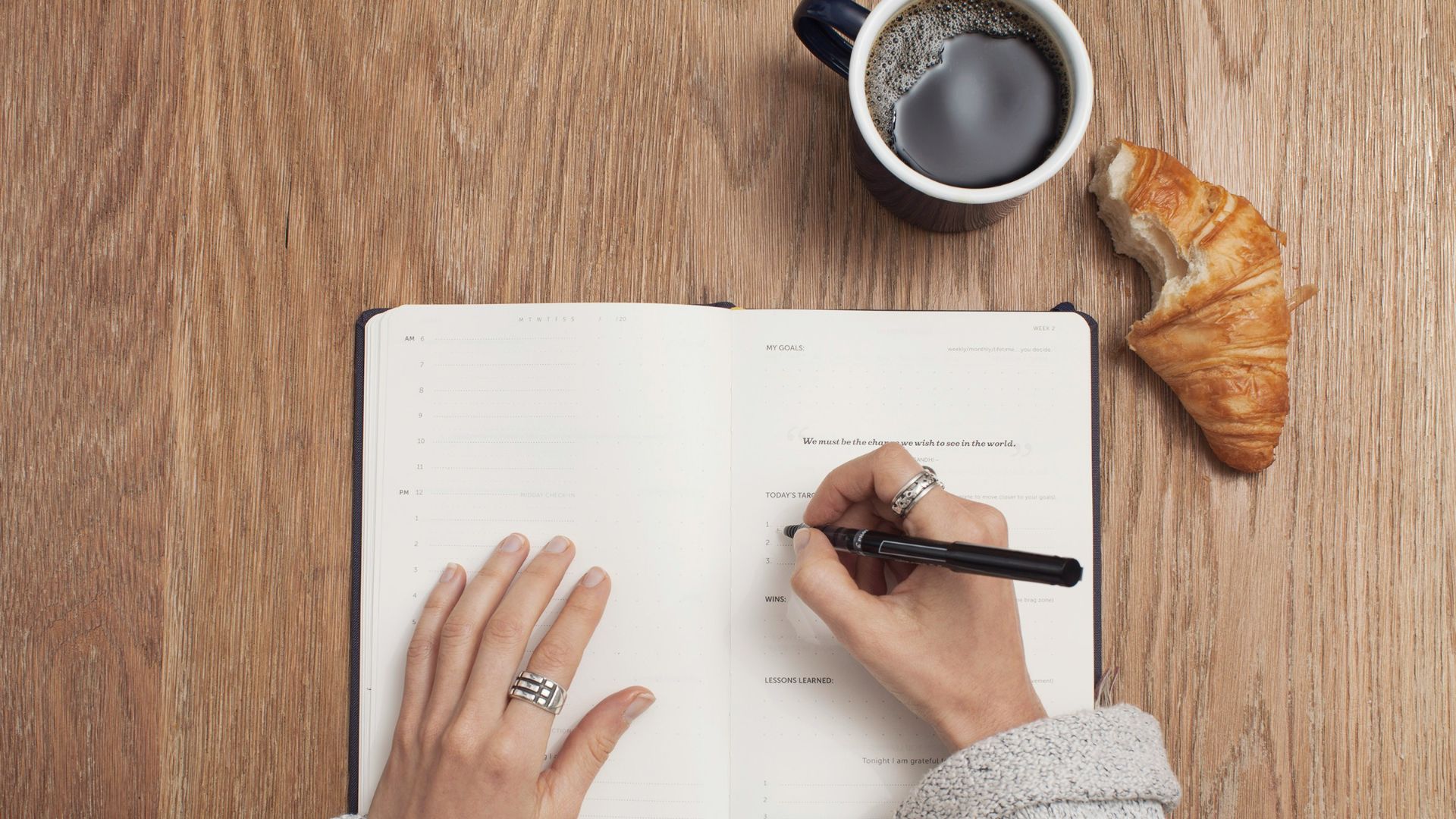 person writing on a book