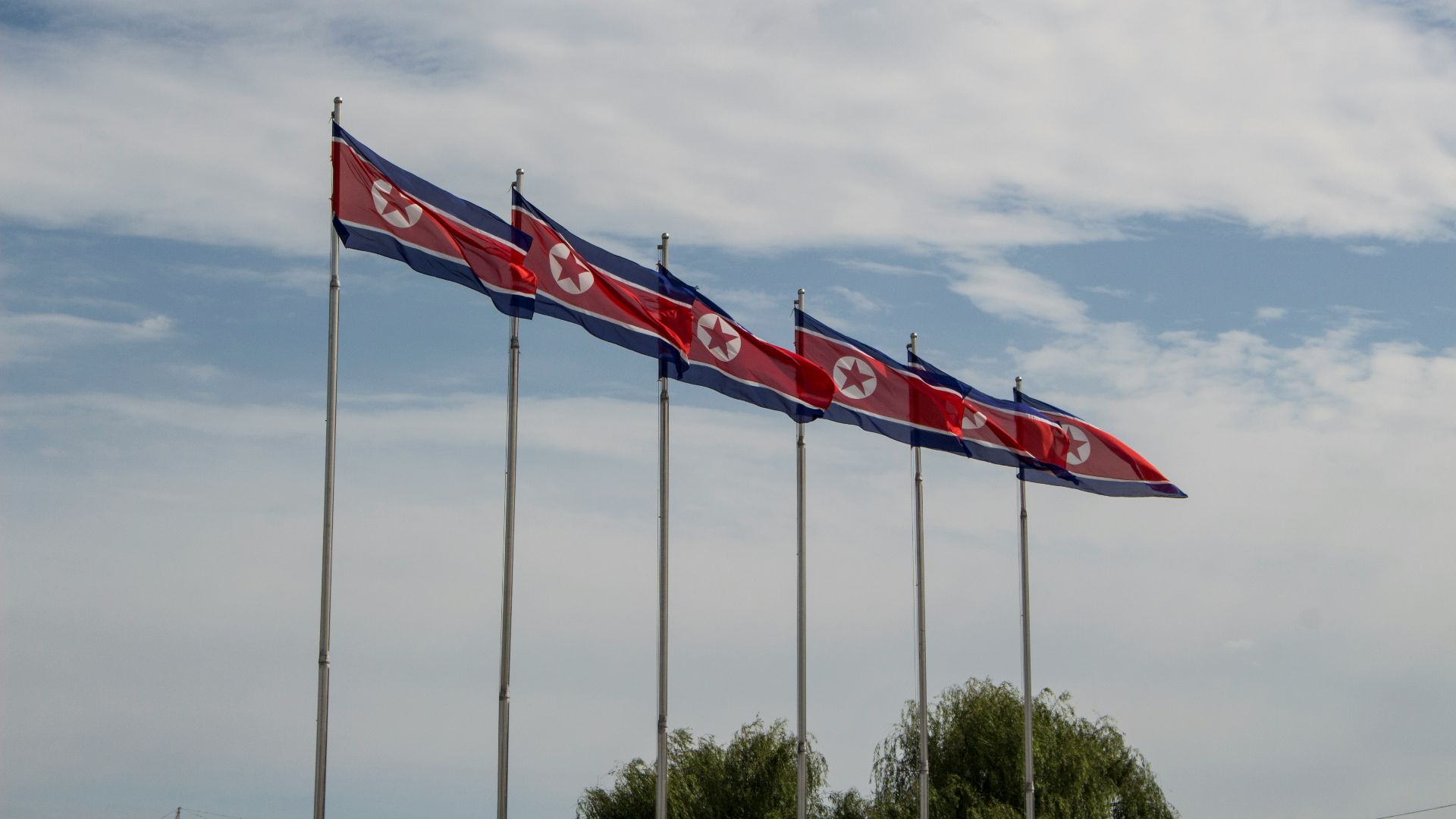 red and white flags on poles