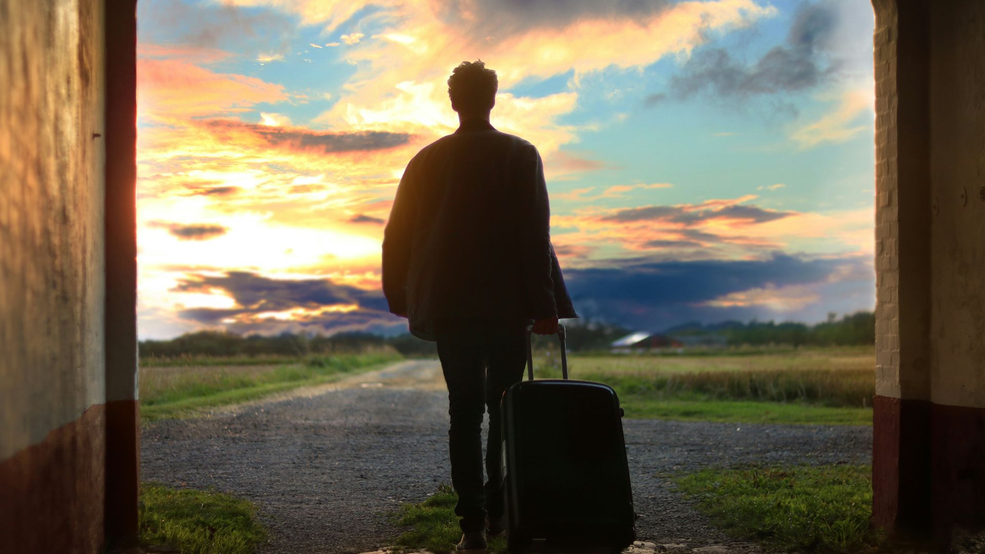 man holding luggage photo