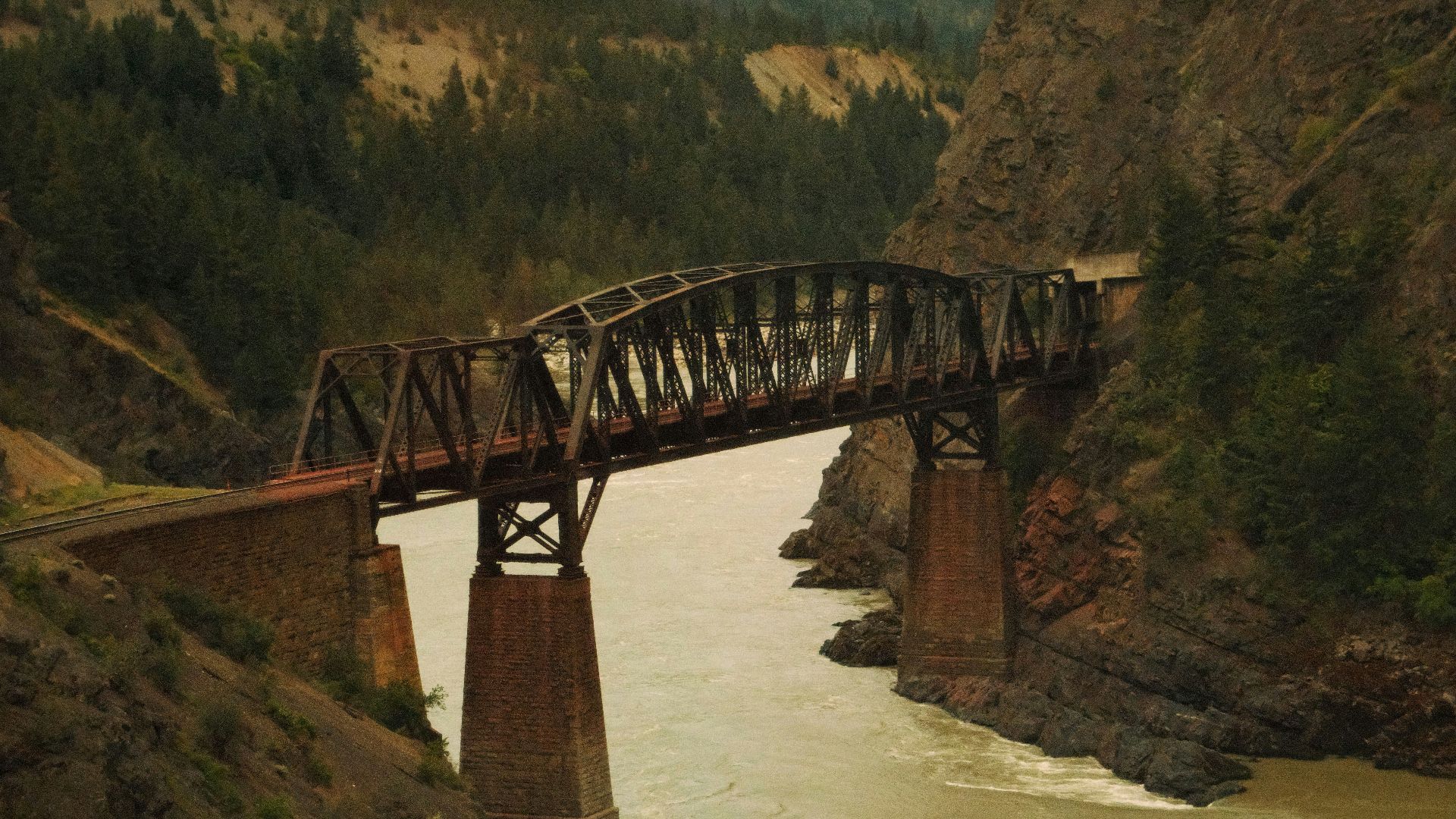 A train crossing a bridge over a river