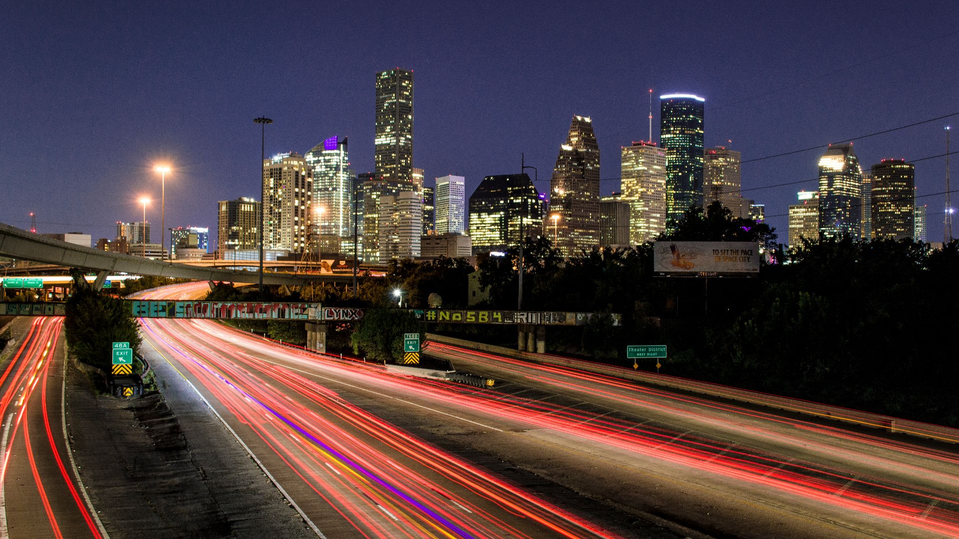 time lapse photography of vehicle traveling with a speed of light in road